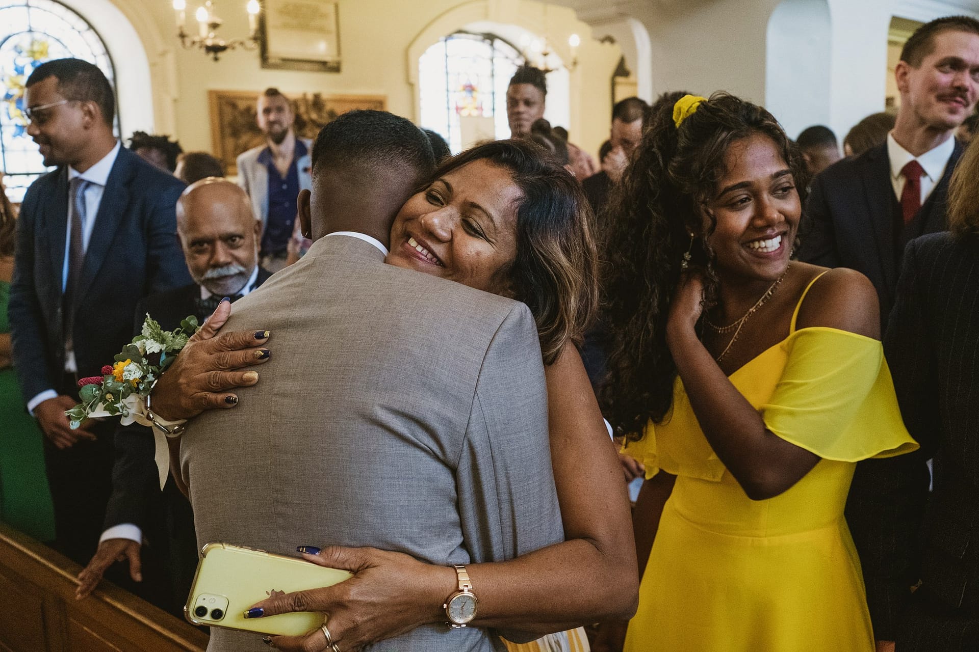 A woman hugging a man at a Greenwich Yacht Club wedding.