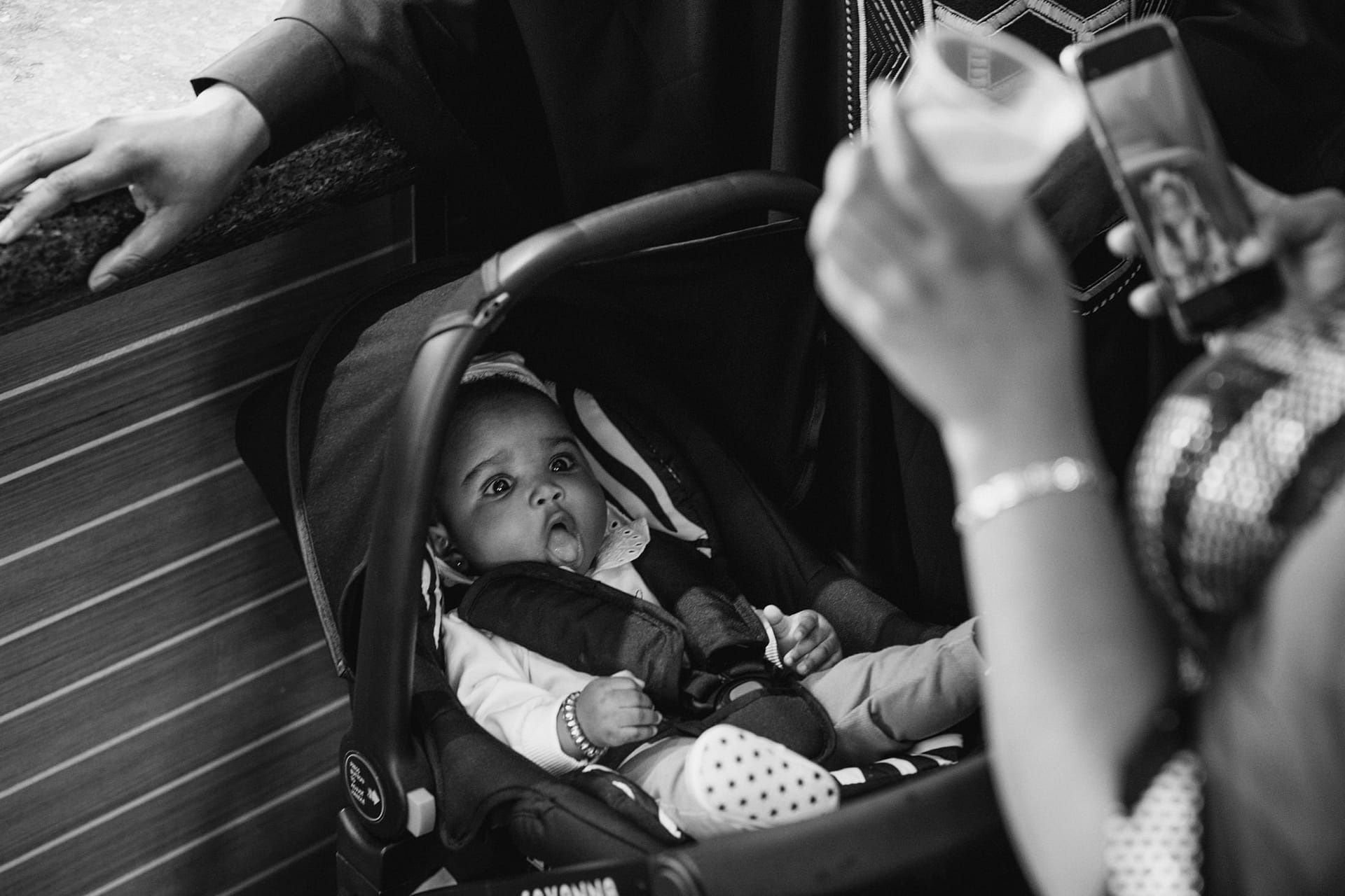 A baby in a car seat at Greenwich Yacht Club.