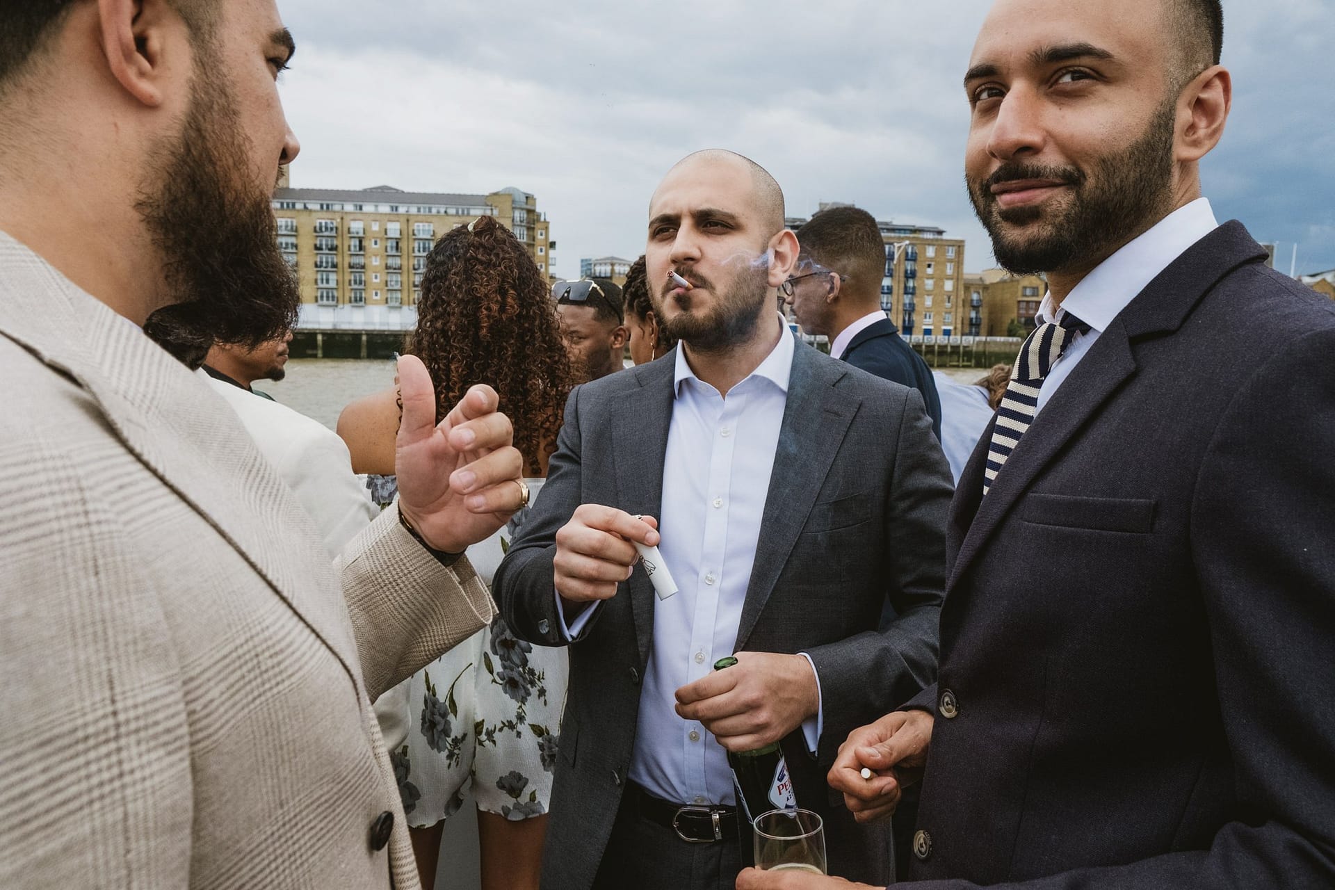 A group of men smoking at the Greenwich Yacht Club in London.