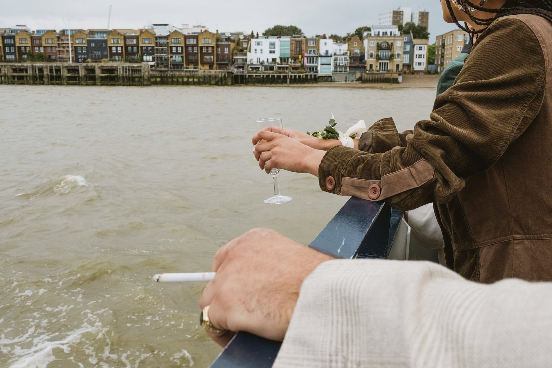 A couple enjoying a romantic evening of wine and leisure on a boat at Greenwich Yacht Club in London.