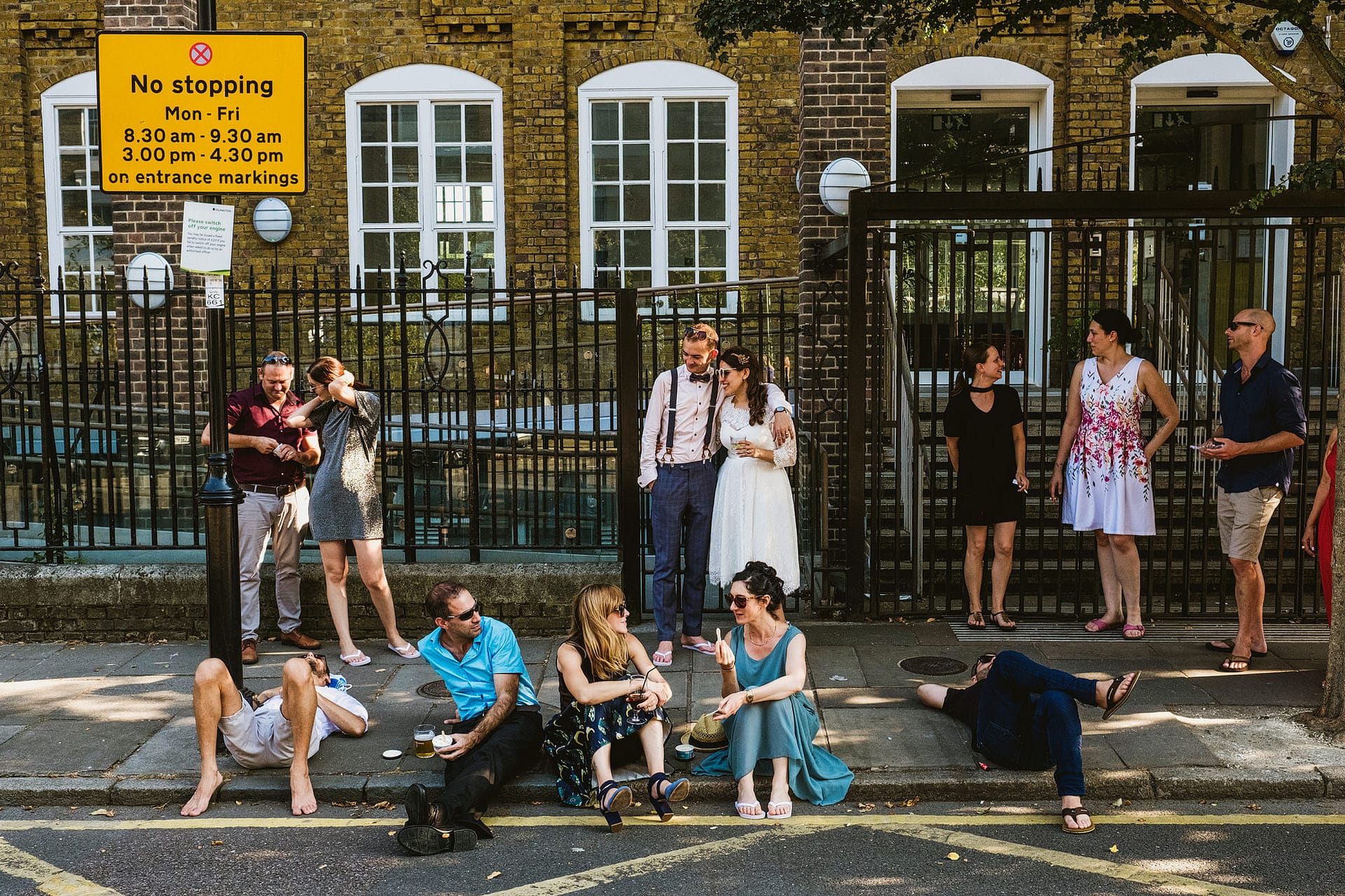 Documentary wedding photograph of a wedding reception street scene in Hackney.