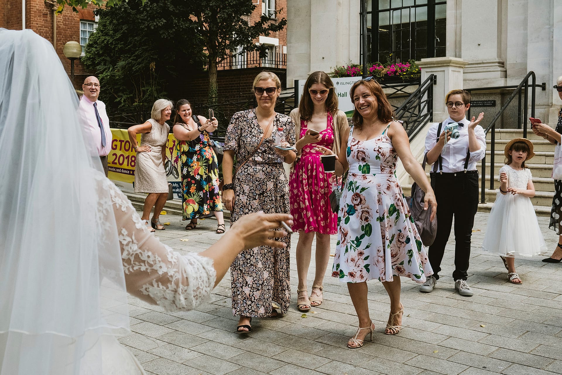 Bride meeting guests, Islington Town Hall