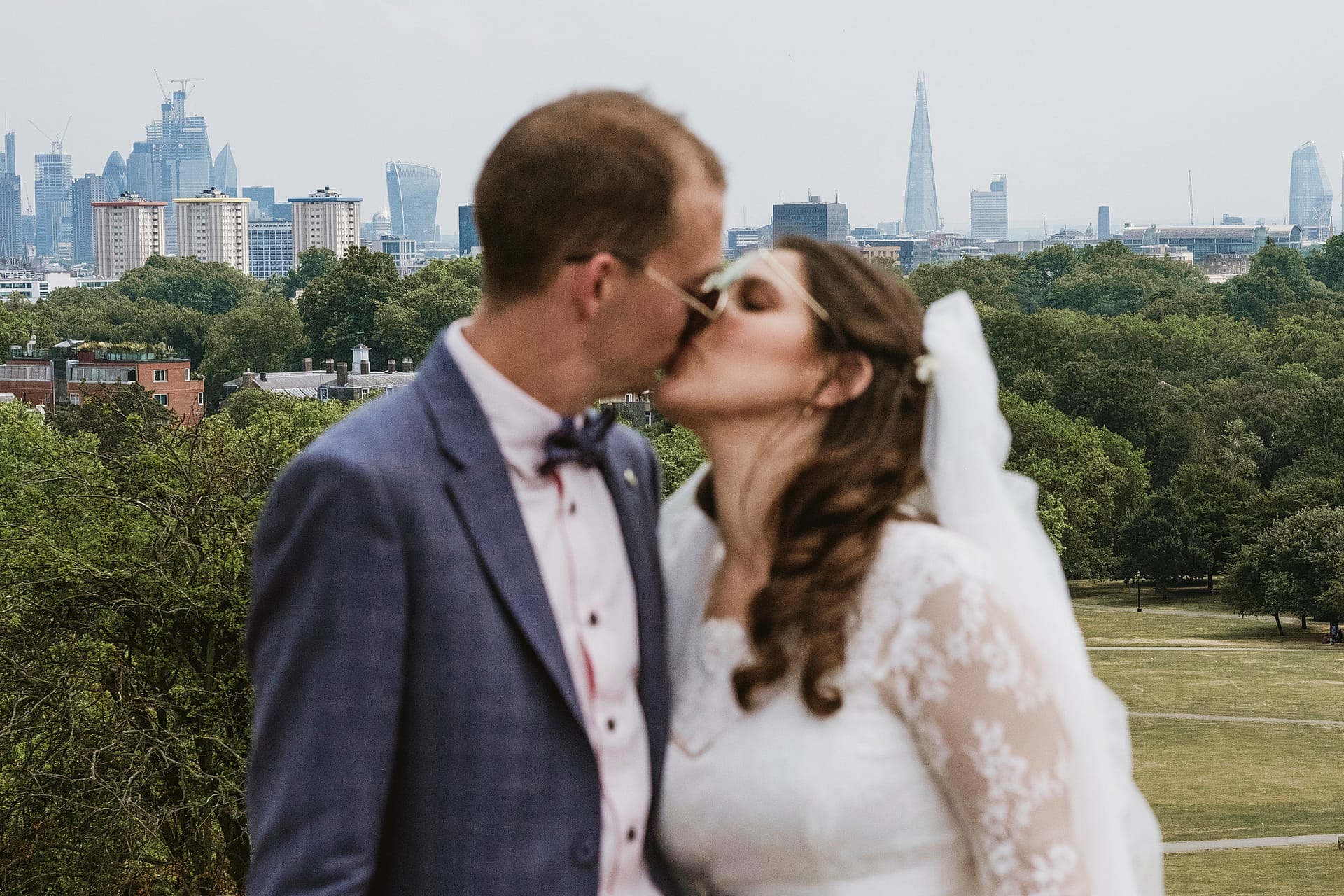 Bride and groom with London skyline