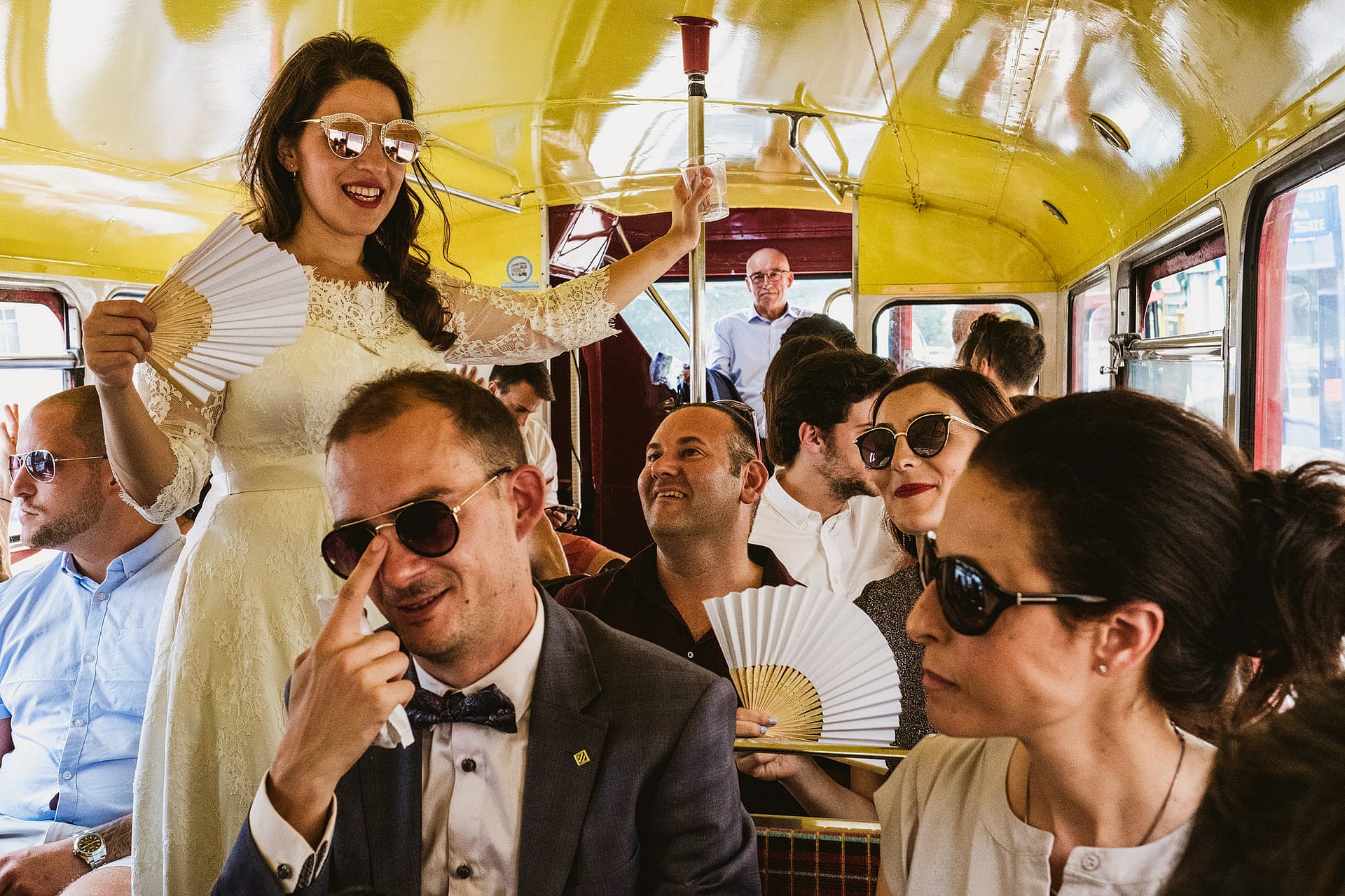 Bride and groom on bus wedding photograph