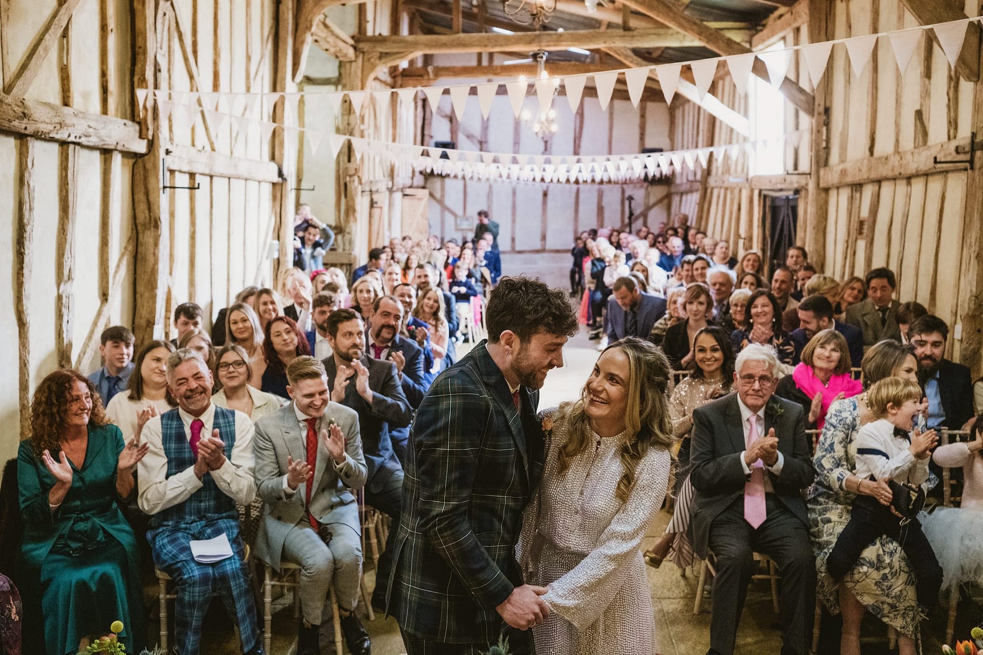 Alpheton Barns wedding ceremony, bride and groom holding hands