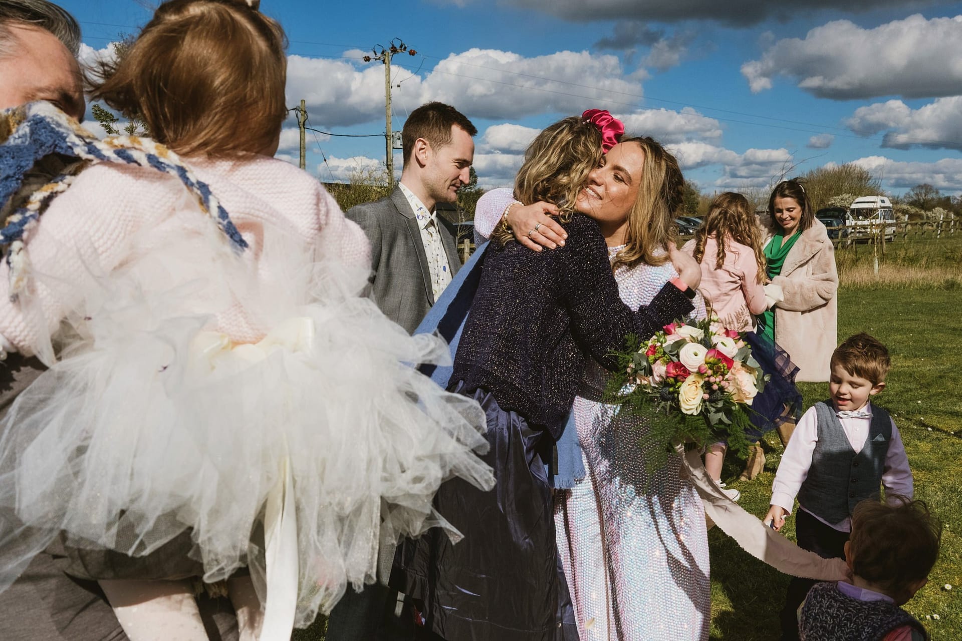 bride hugging guest after the ceremony at Alpheton Barns
