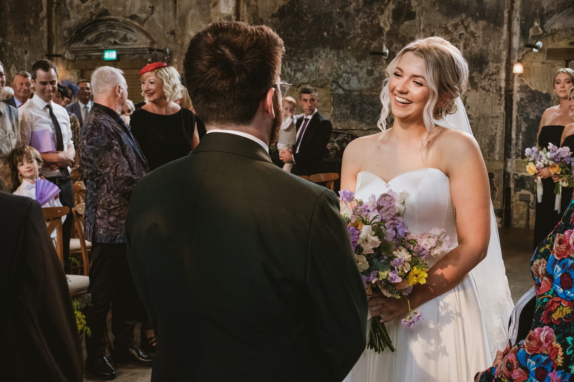 Bride and groom exchanging vows at wedding ceremony