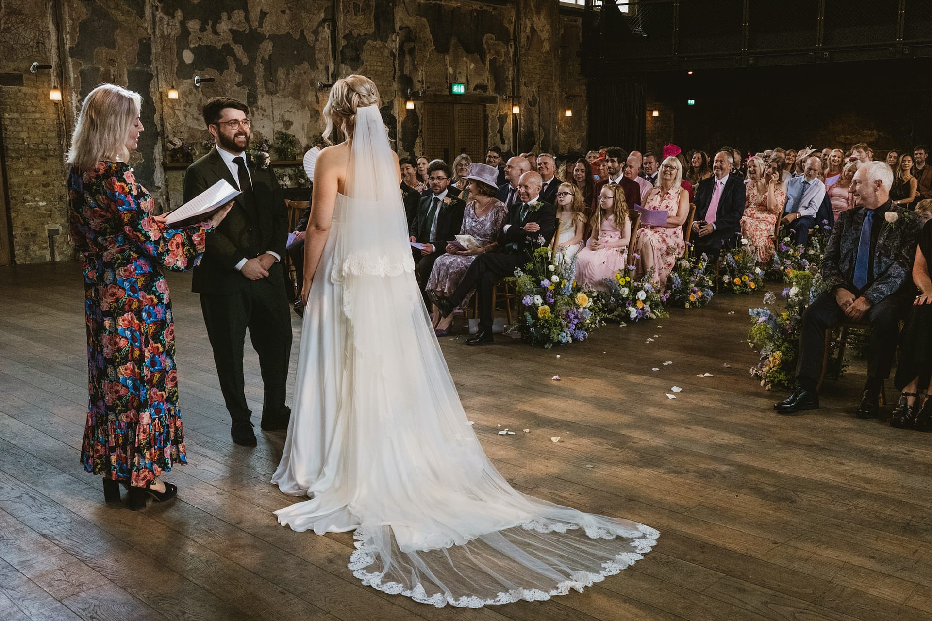 Bride and groom at wedding ceremony indoors.
