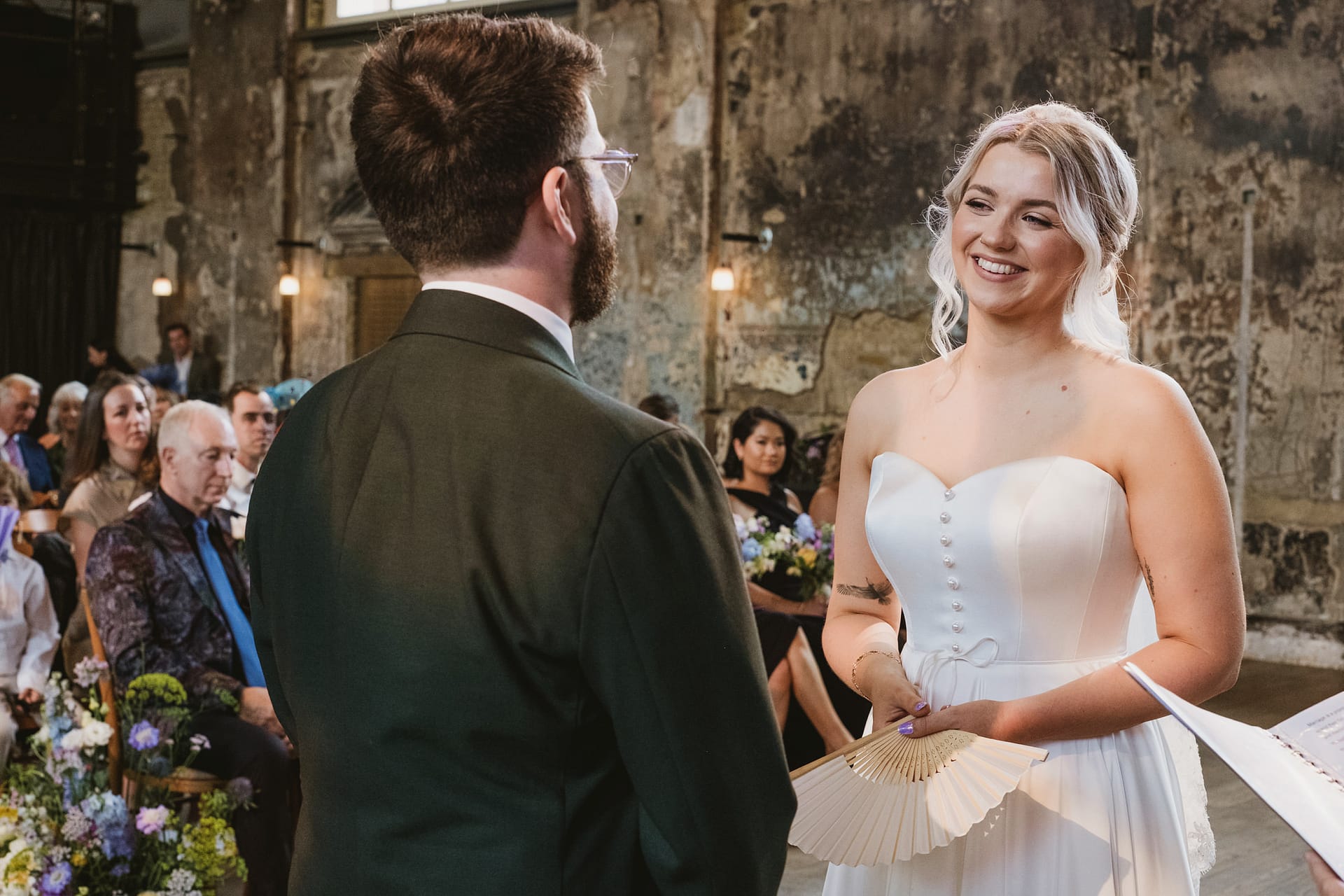 Bride and groom exchanging vows at wedding ceremony.