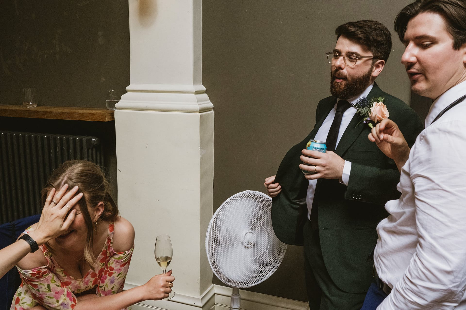 Group socialising with drinks indoors