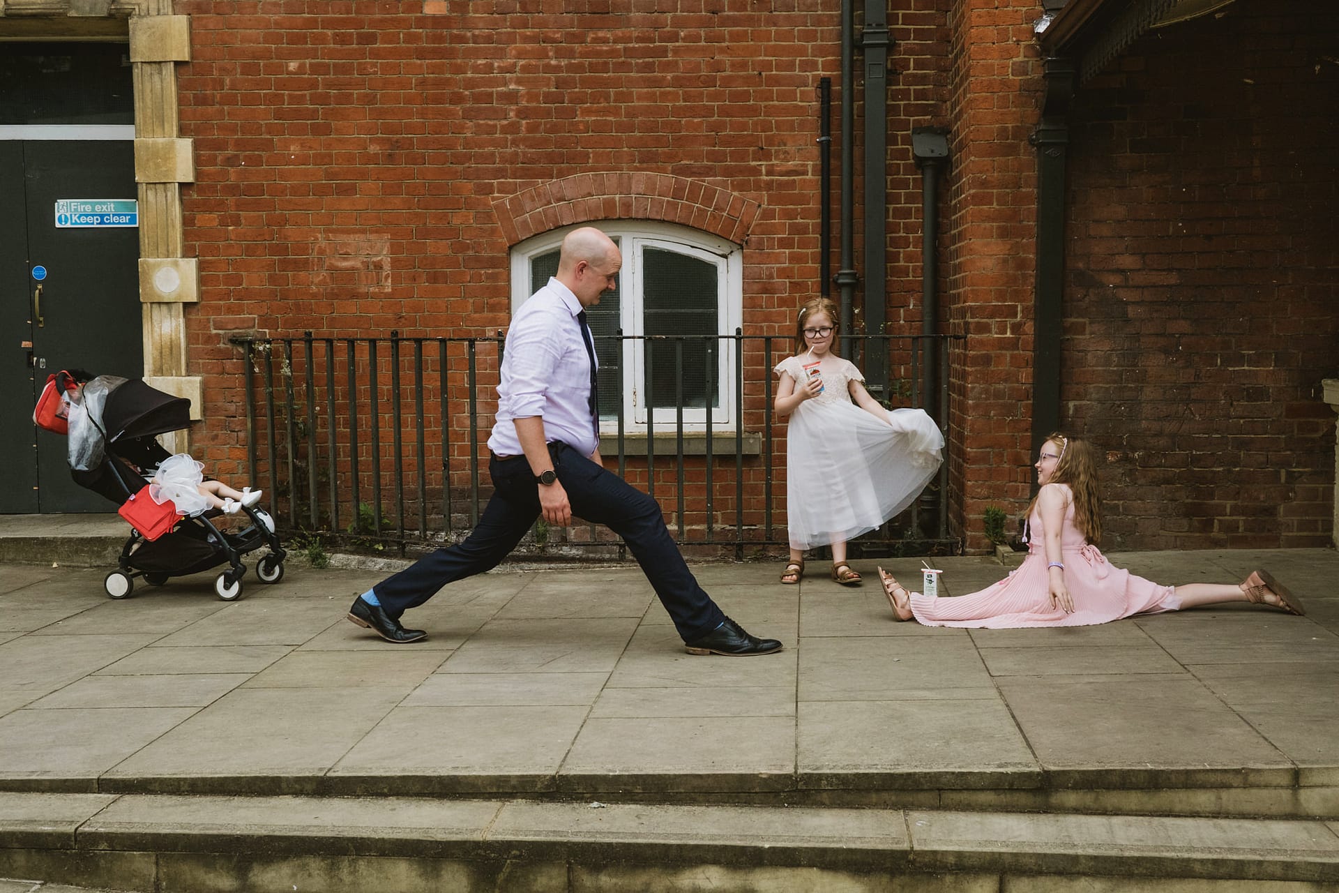 Man and children outdoors, having fun.