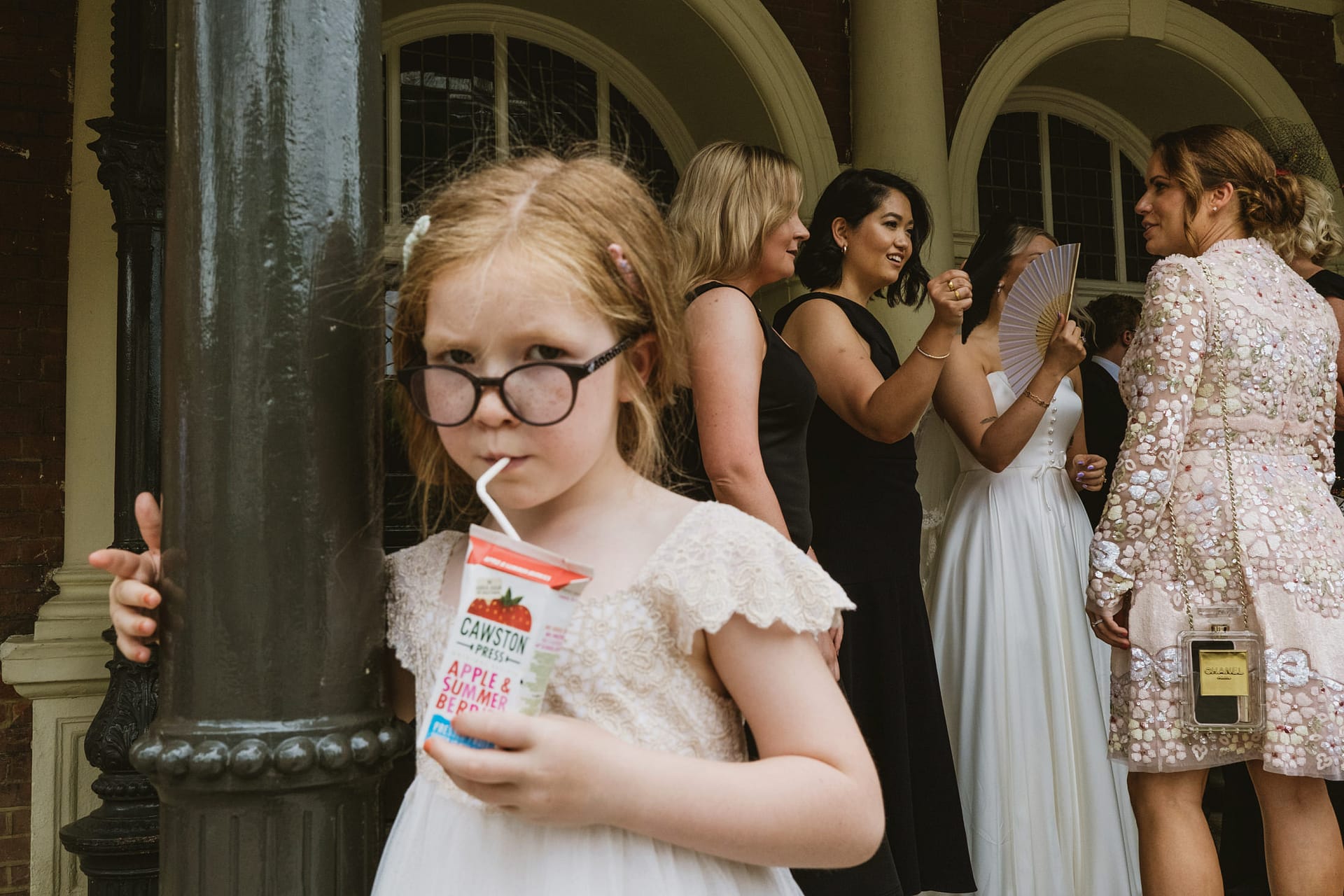 Child drinking juice at formal event