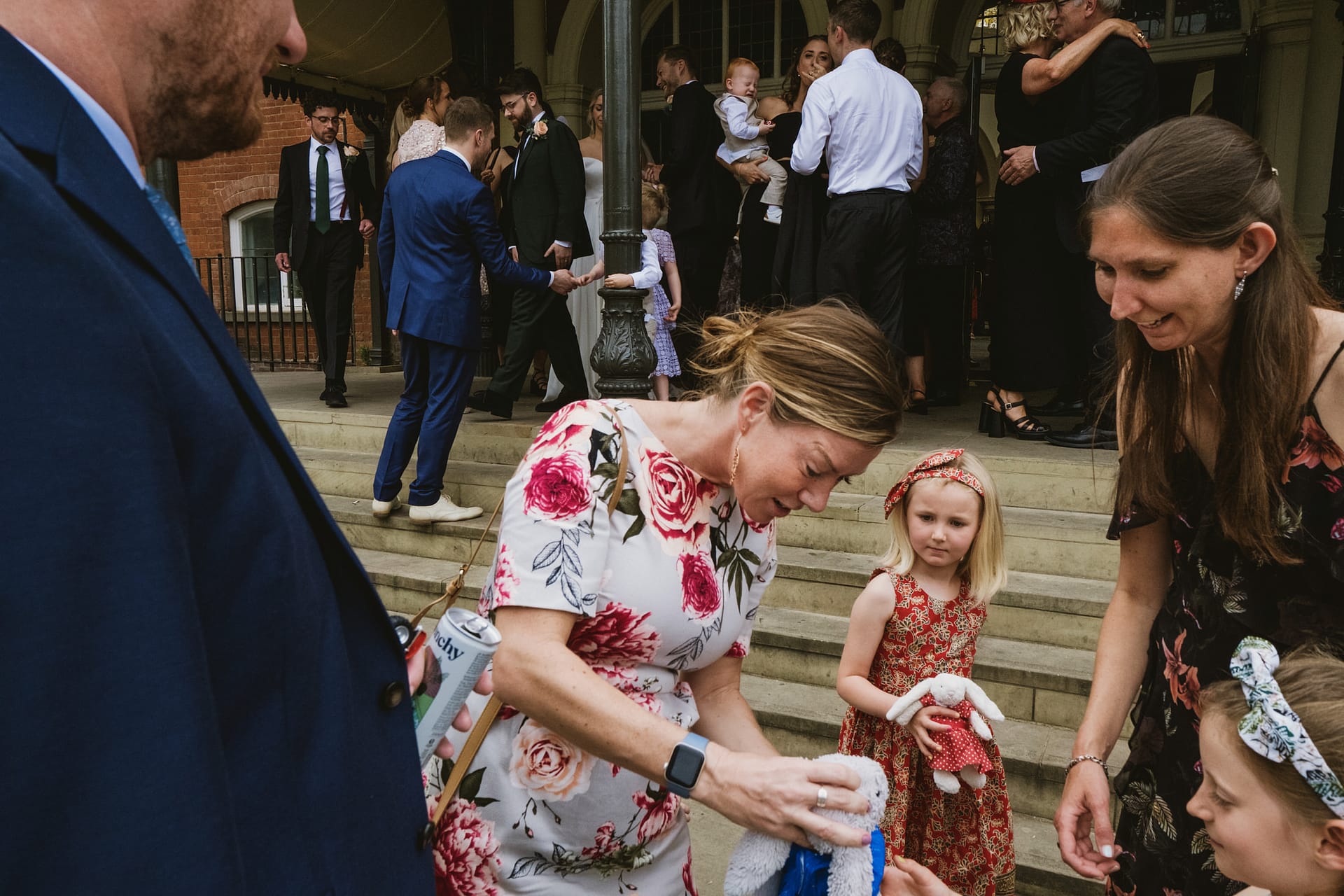 Group of people outside a building during celebration.