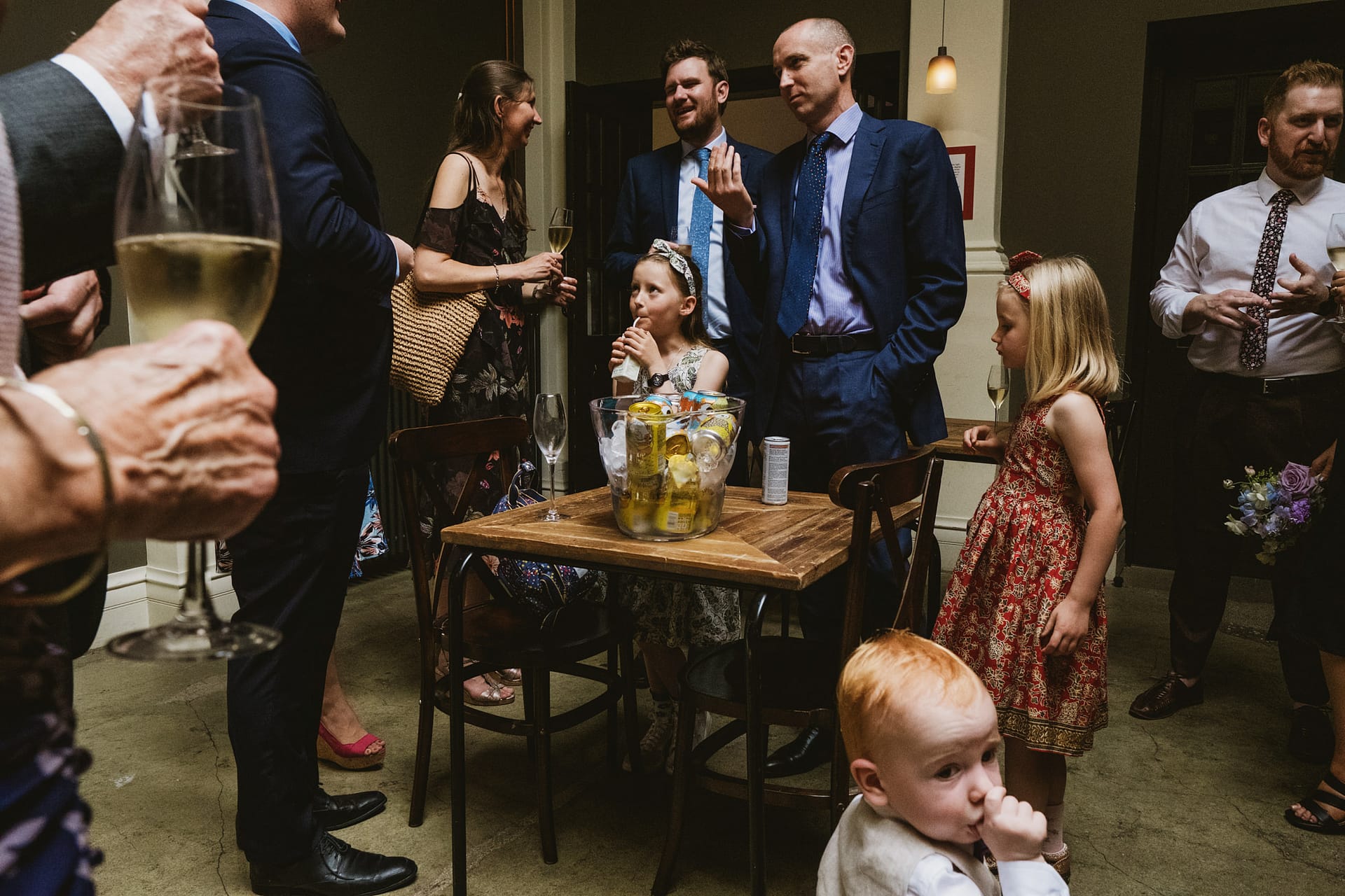 People socialising at a formal event with drinks.