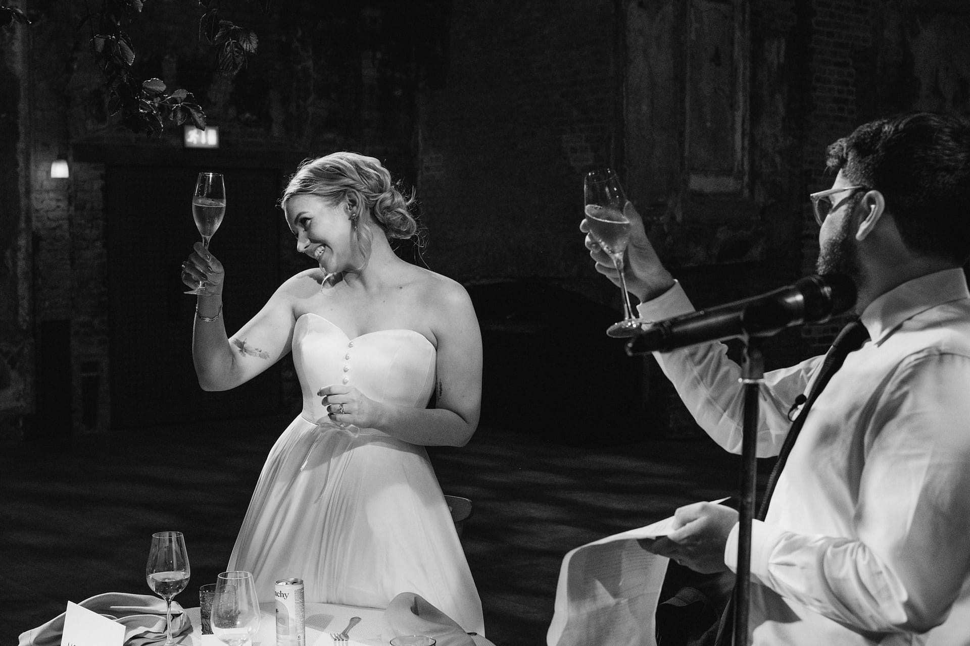Bride and groom toasting at wedding reception