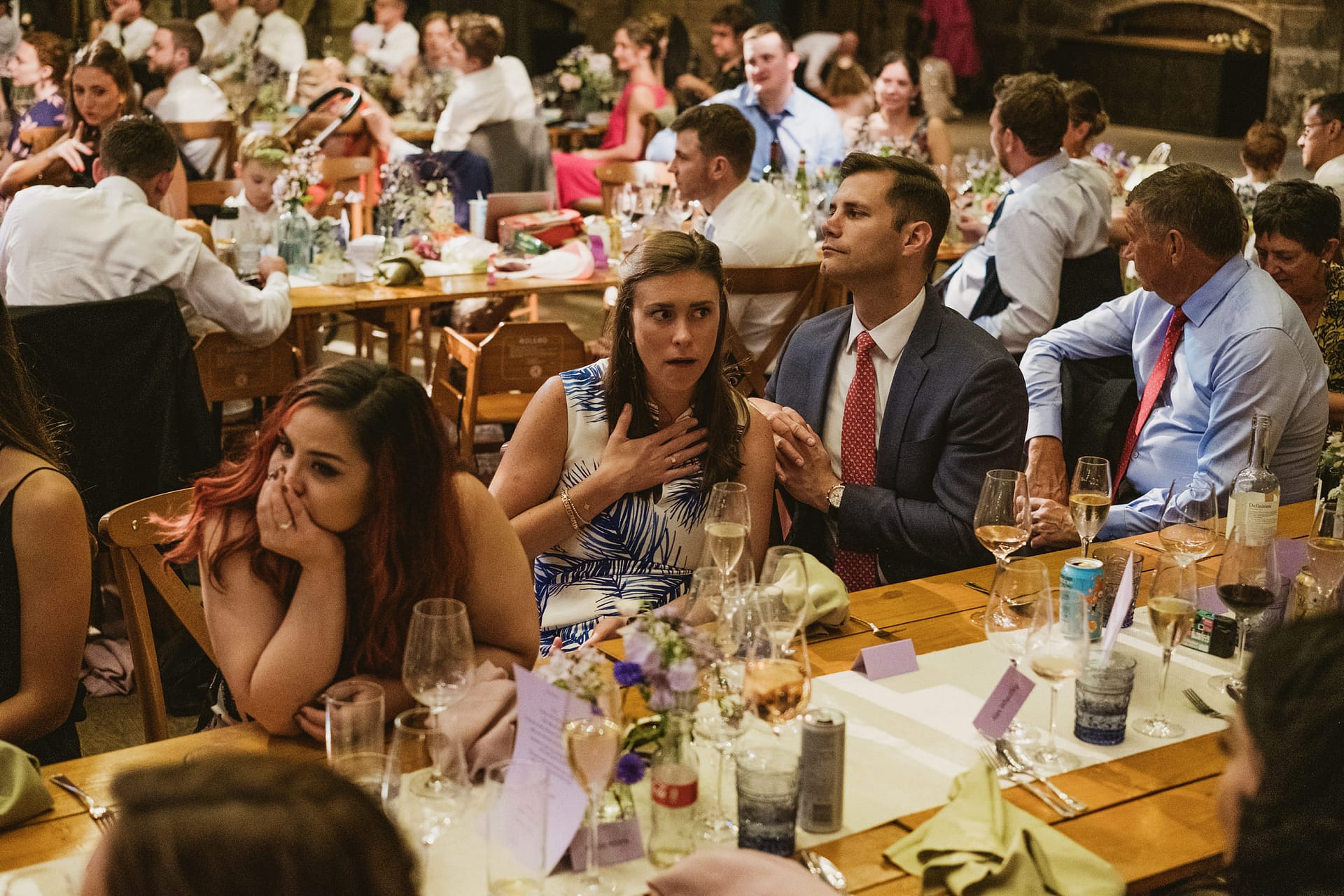Guests seated at elegant wedding reception.