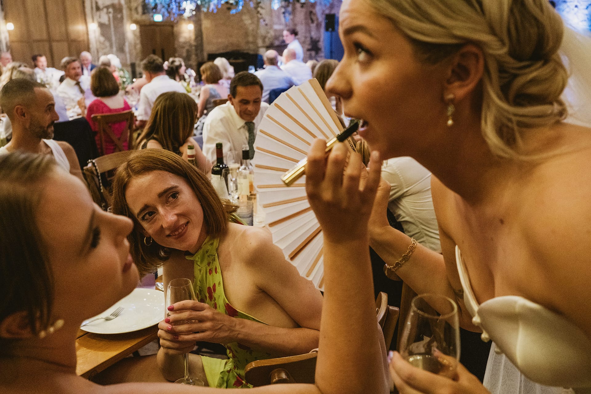 Guests chatting at a lively wedding reception.