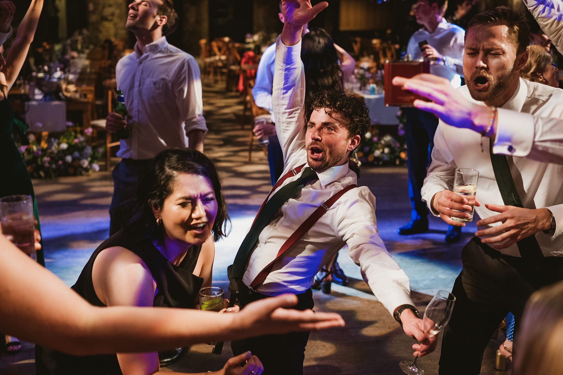 People dancing energetically at a lively party.