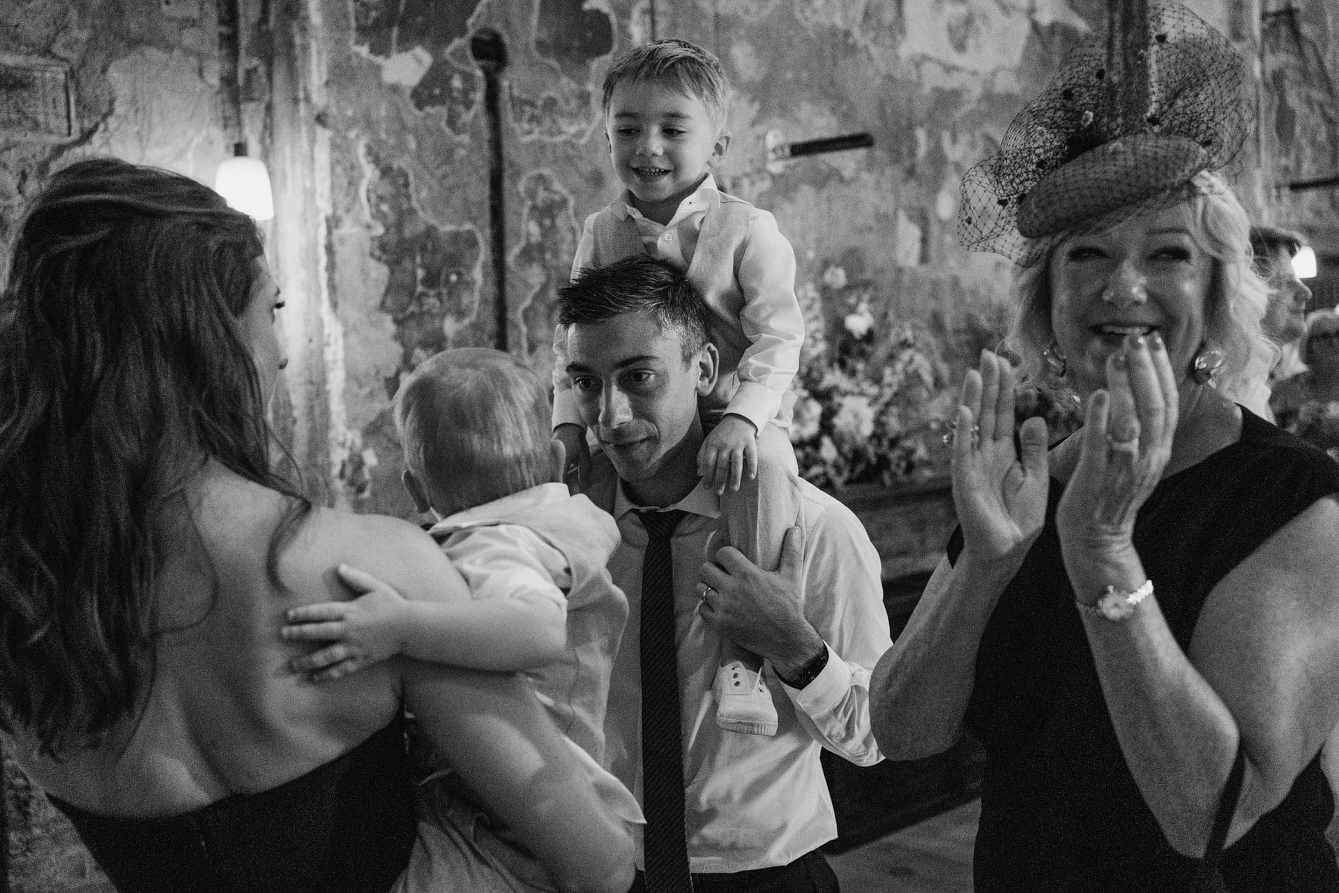 Family celebration with smiles and clapping.