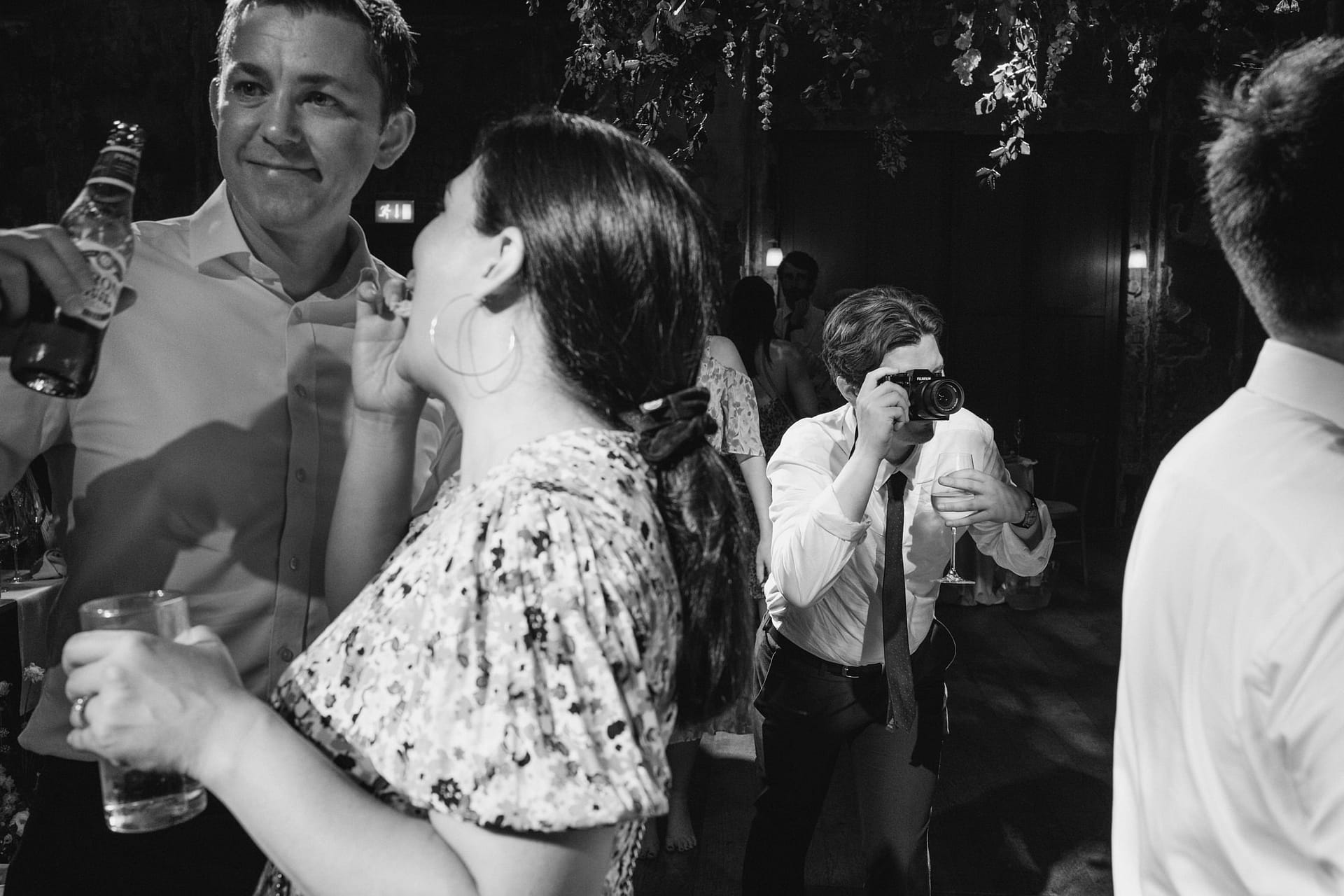 People enjoying drinks at a lively party.