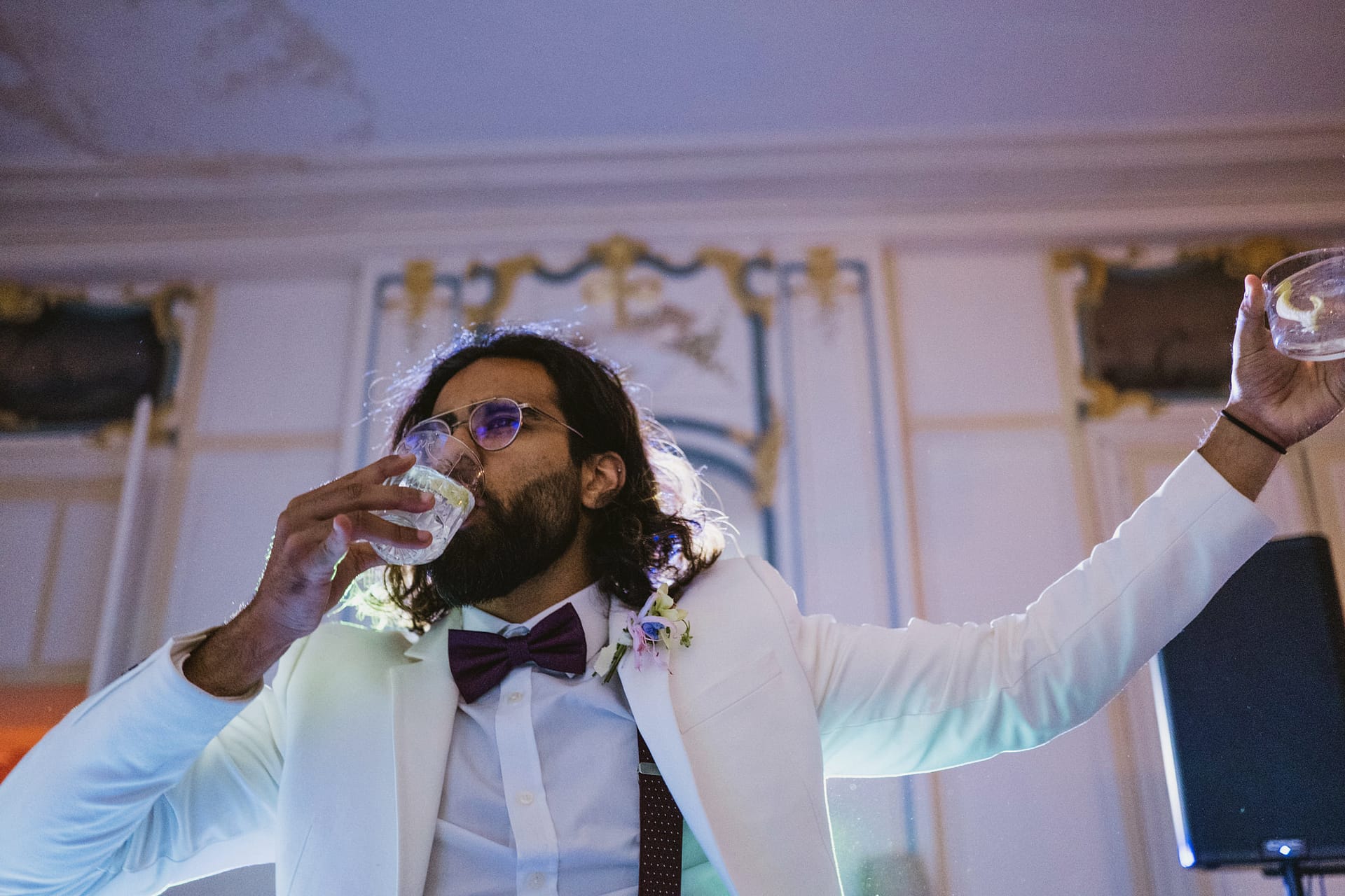 The best man drinking on the dance floor and dancing at Chateau du Fey in France