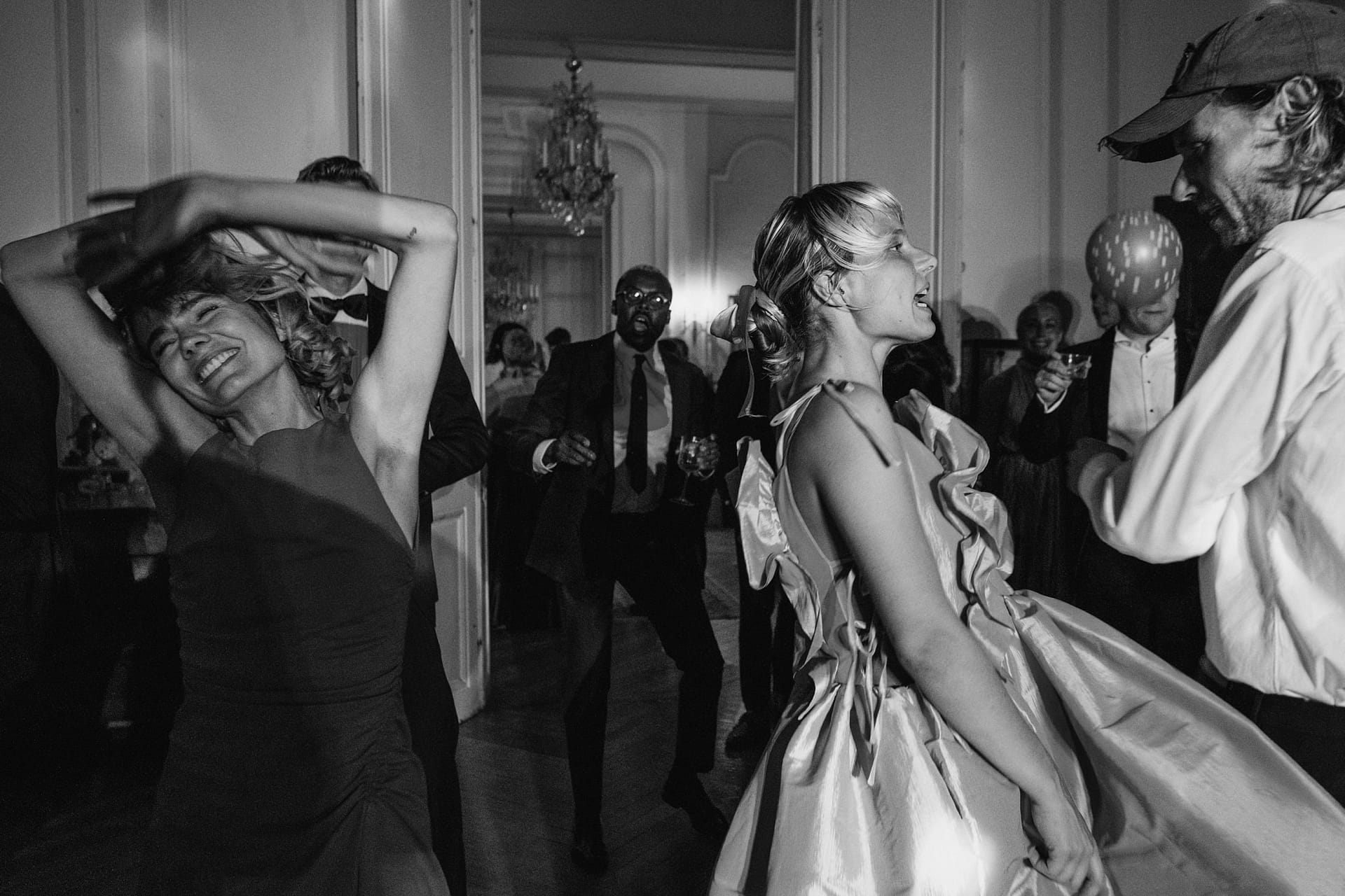 Chateau du Fey wedding reception in France. Black and white photo of wedding guests dancing
