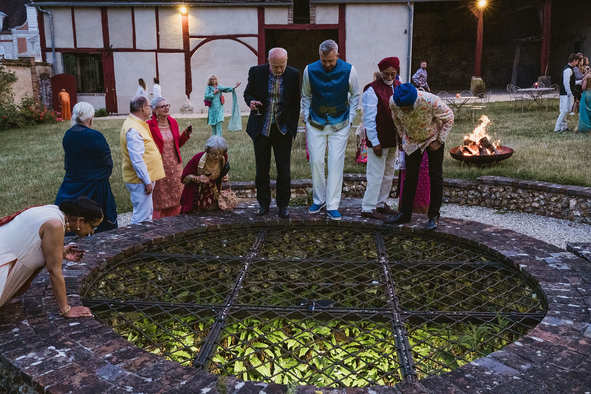 wedding guests outside in the evening at Chateau du Fey in France