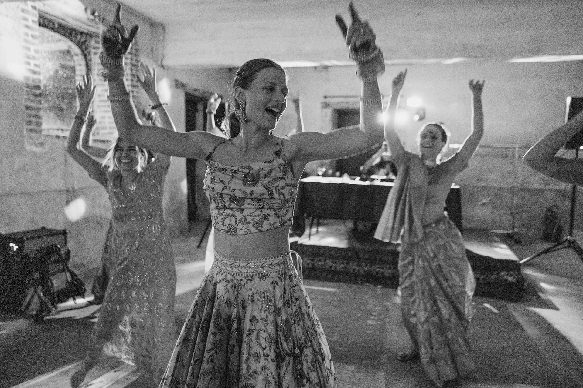 Bride dancing during the Indian mendhi at Chateau du Fey in France