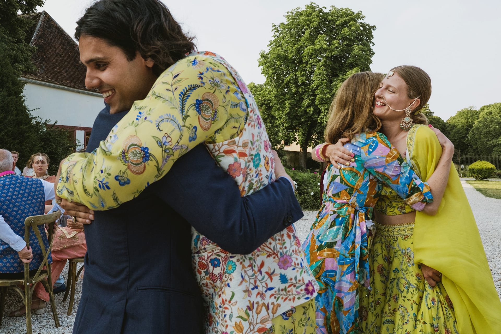 Double hug from the groom and the bride to their wedding guests at the reception of Chateau du Fey in the beautiful heart of the Burgundy region