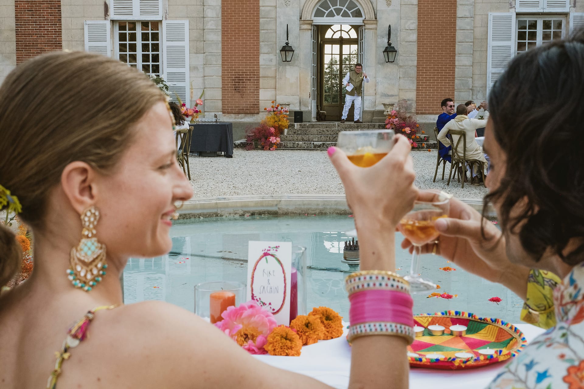 Bride and groom cheers at the father of the bride speech at Chateau du Fey