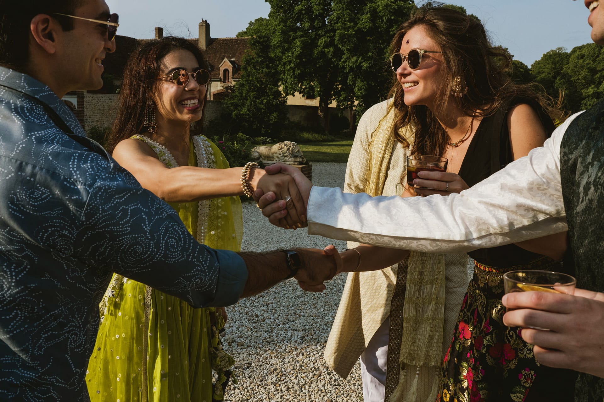 wedding guests meet and shake hands at Chateau du Fey in France