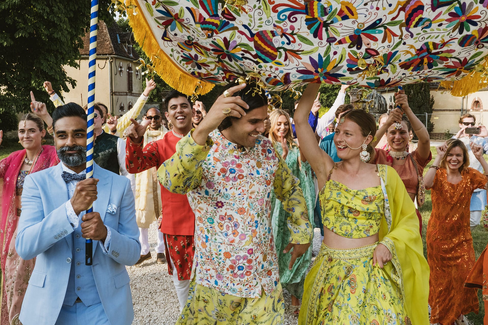 the bride and groom's entrance during the indian wedding celebrations at Chateau du Fey