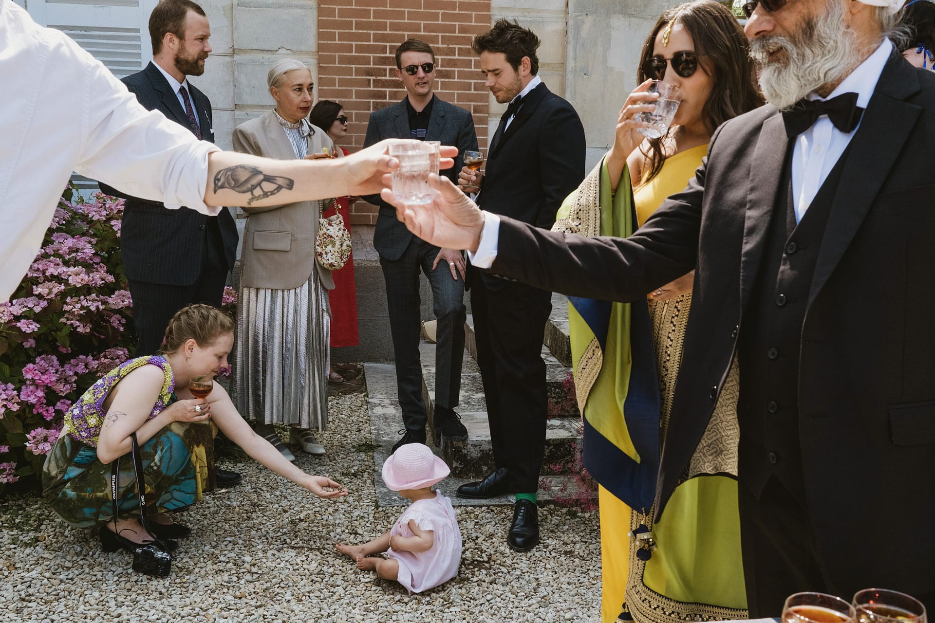 wedding guests congregate before the ceremony in France