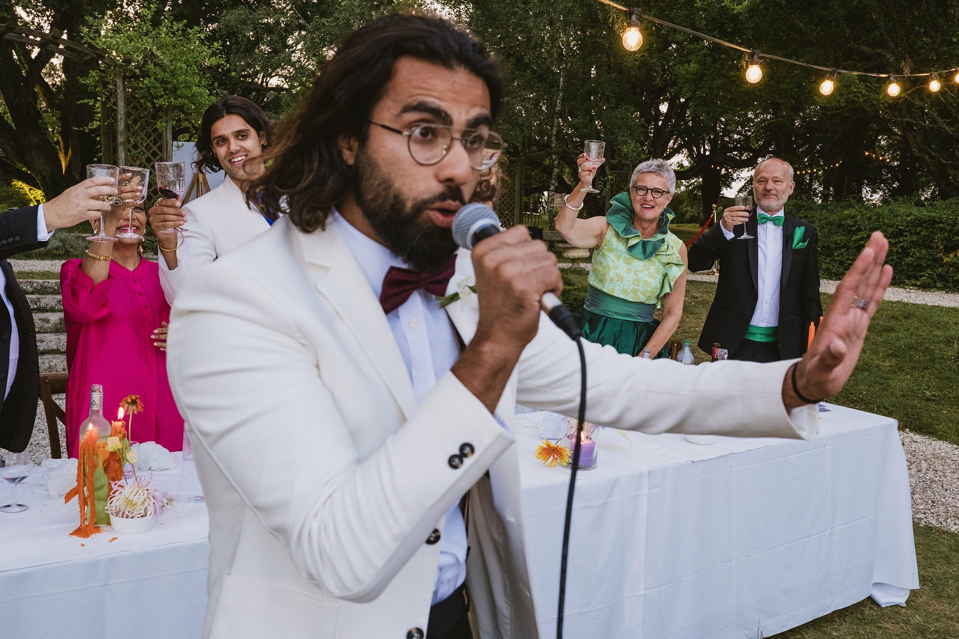 the best man speech with the groom and the bride's parents in the background at Chateau du Fey in France