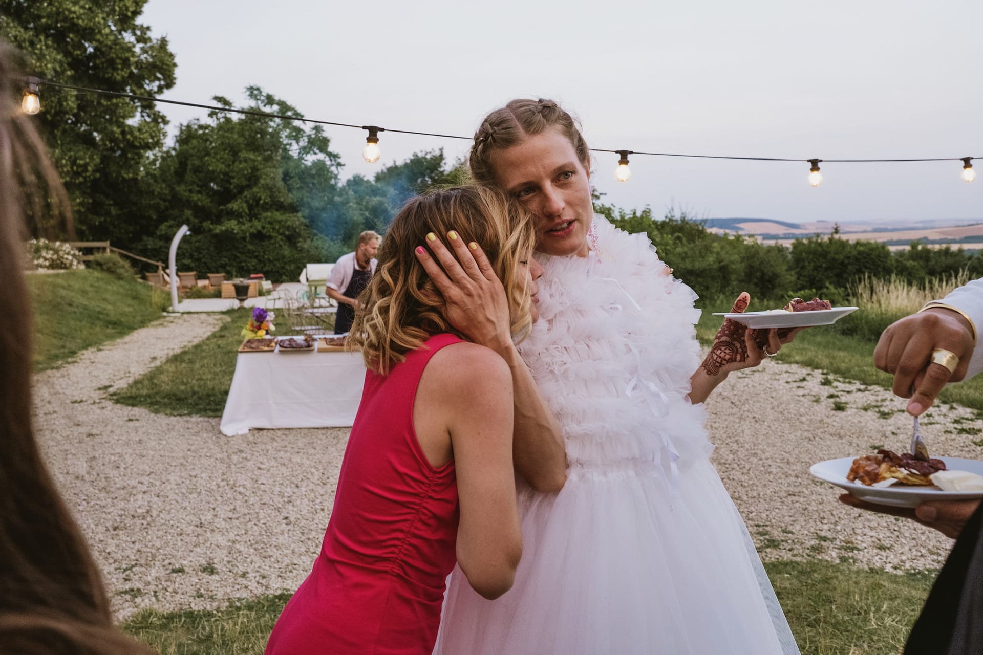 bride hugs wedding guests at Chateau du Fey in France