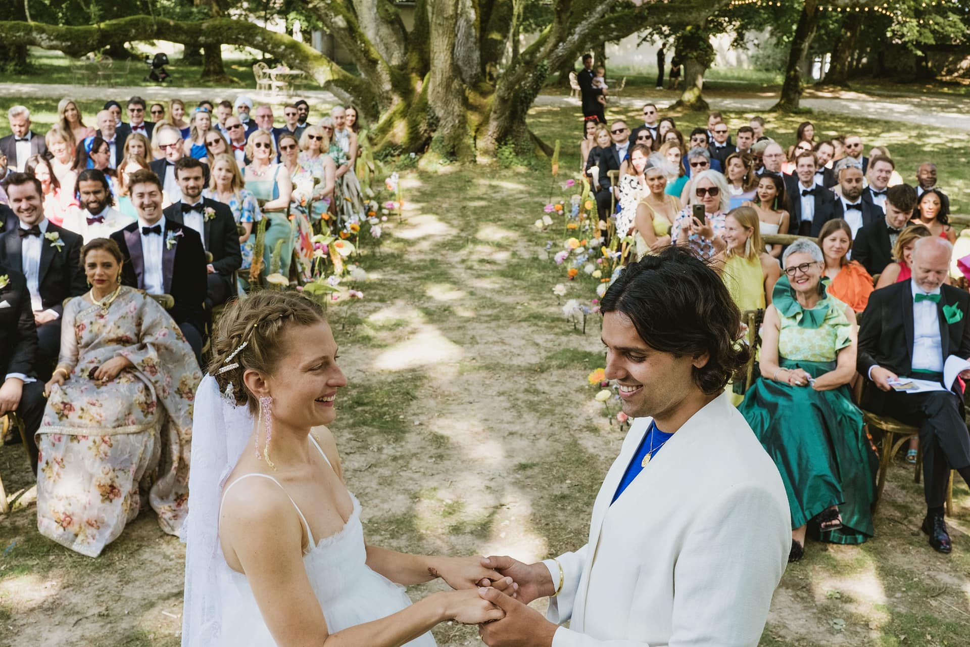 Chateau du Fey in France wedding ceremony. Bride and groom exchange vows.