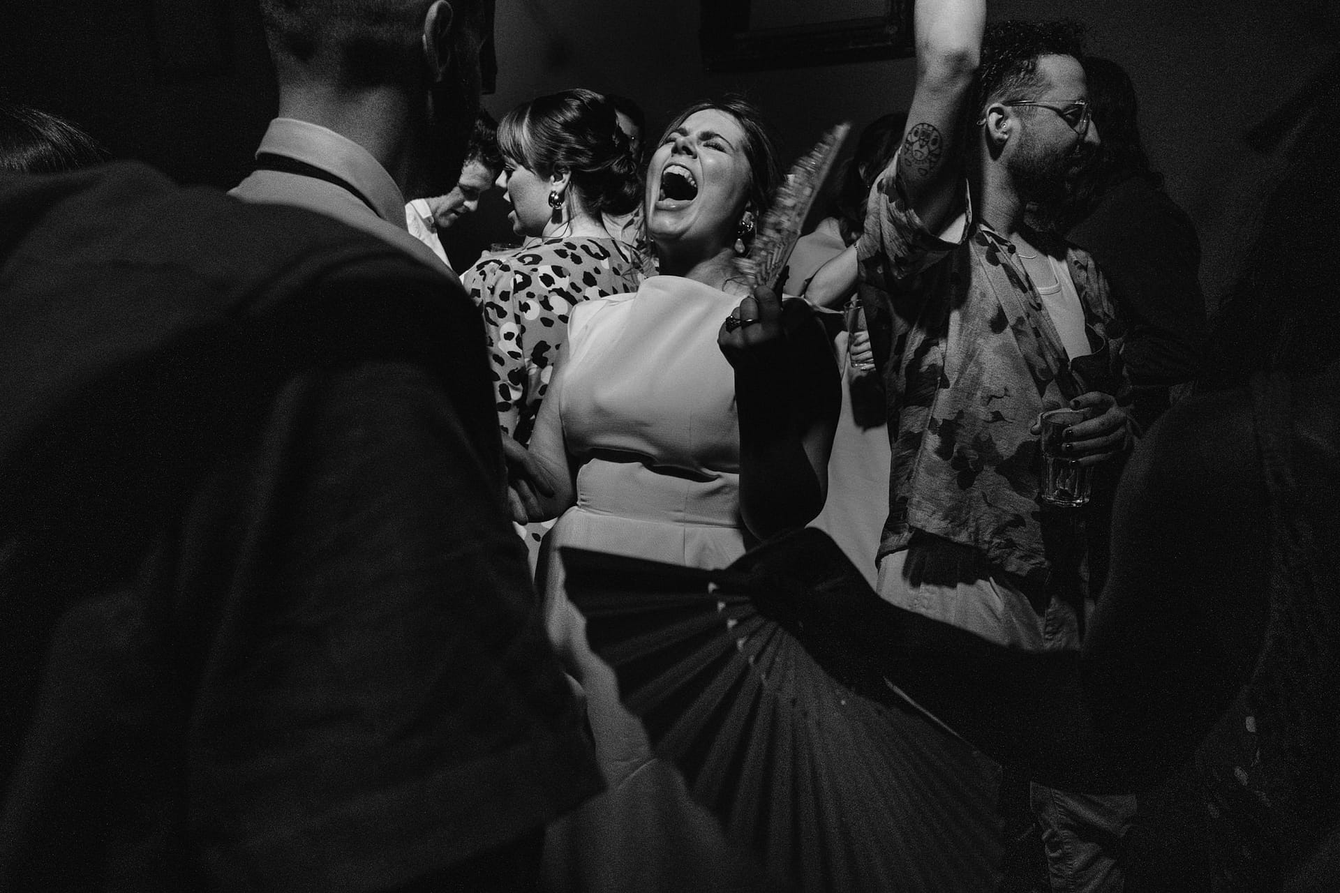 Group of people dancing at a party.