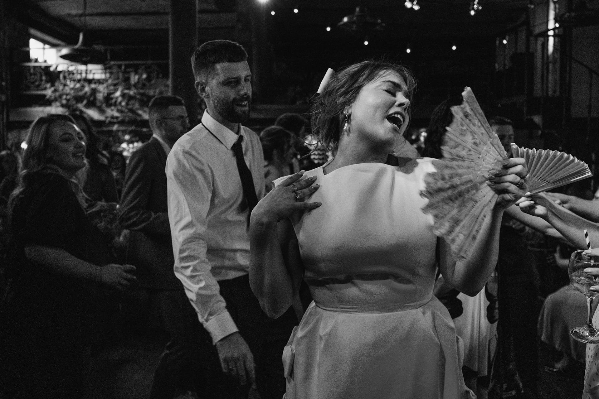 People dancing energetically at a lively party.