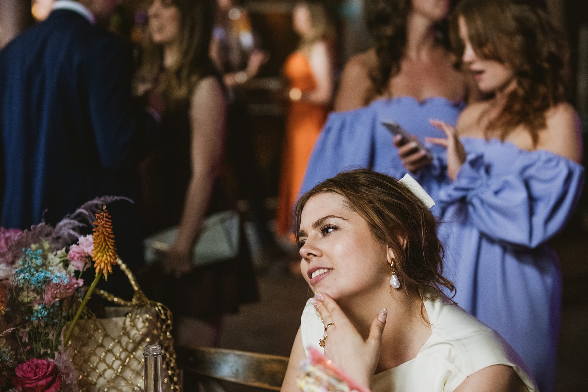 Smiling woman at social event with friends
