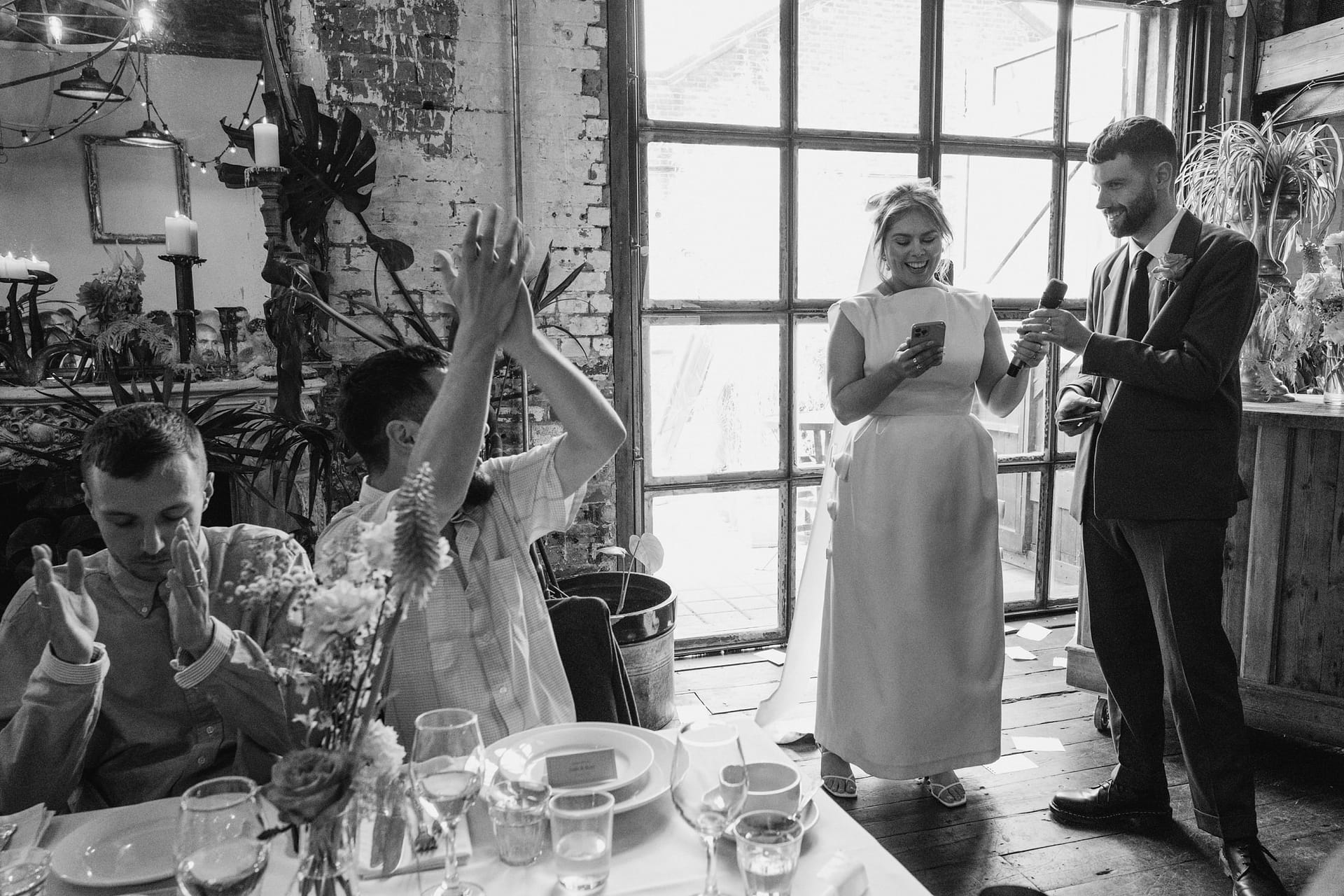 Guests clapping during wedding speech at Clapton Country Club