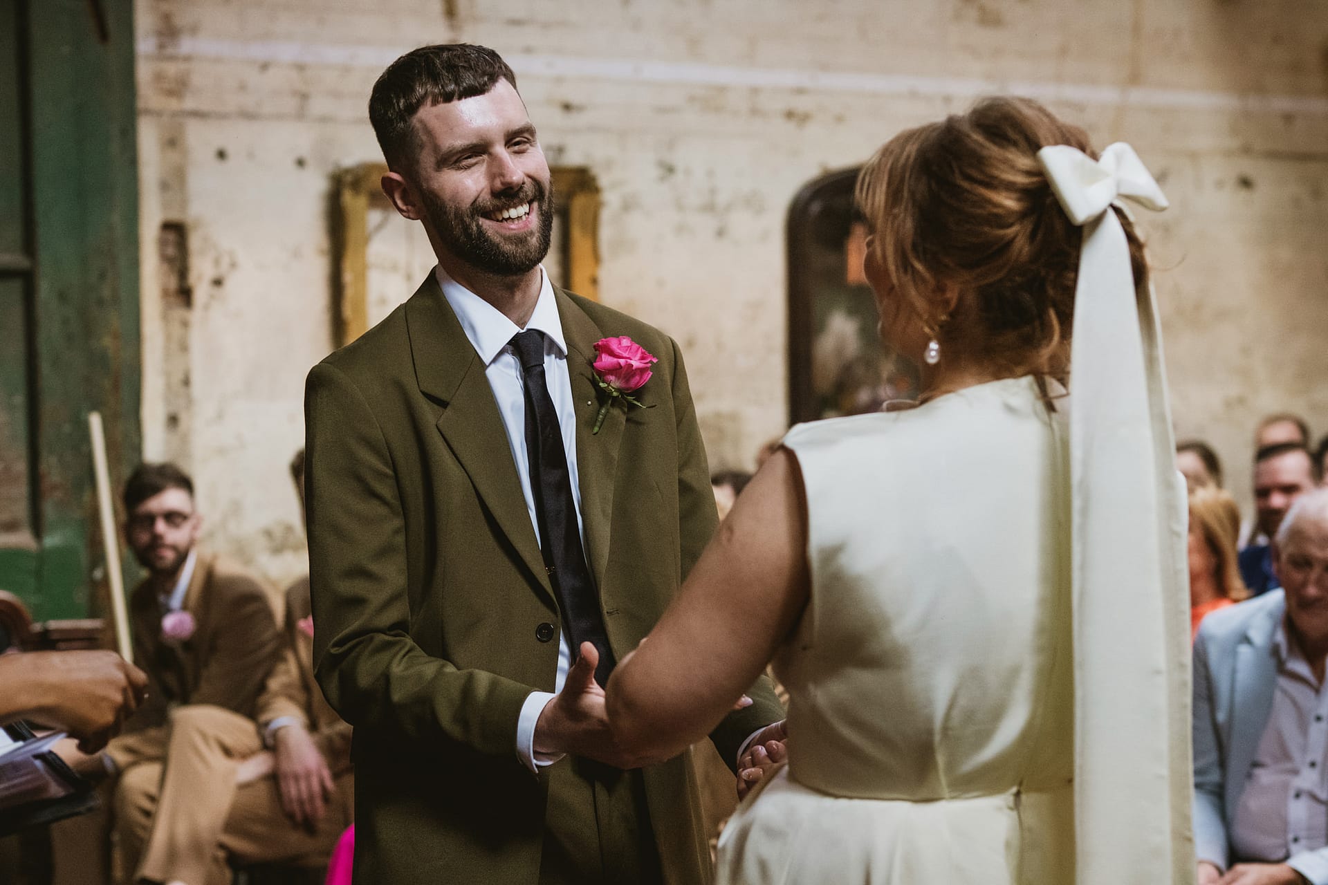 Couple exchanging vows at wedding ceremony.