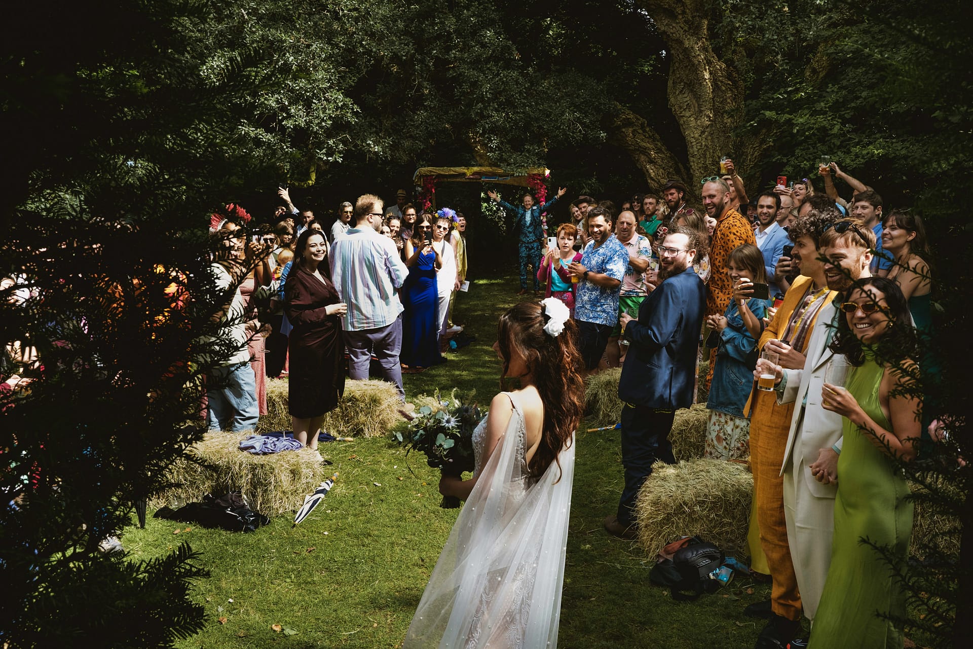 Bride and guests at outdoor wedding ceremony