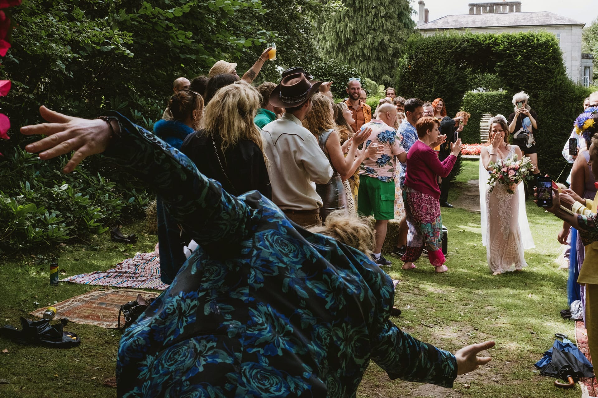 Colehayes Park Devon wedding photography. Outdoor wedding celebration with bride and guests.