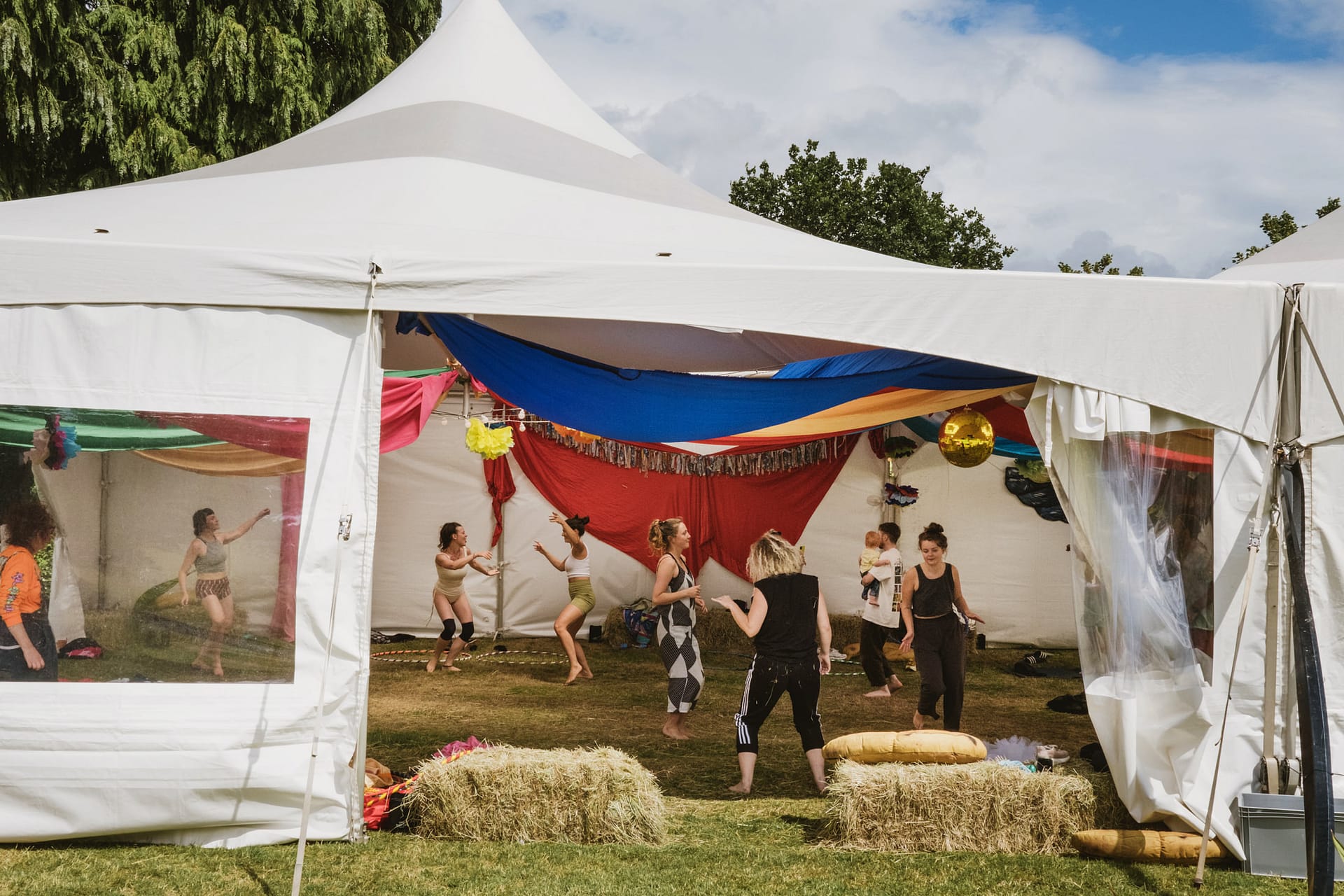 People dancing in a festival tent