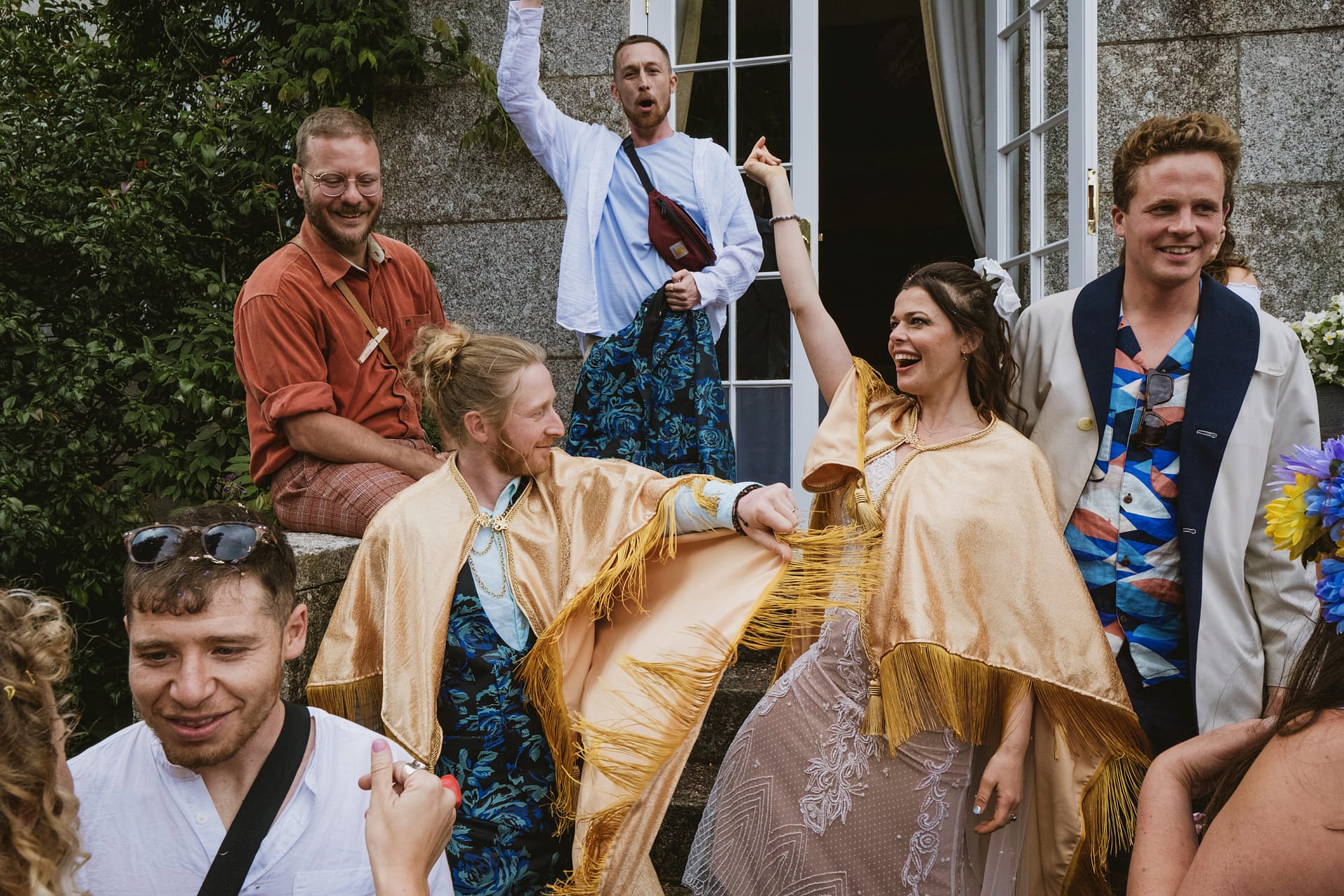 Group celebrating with joy at an outdoor event.
