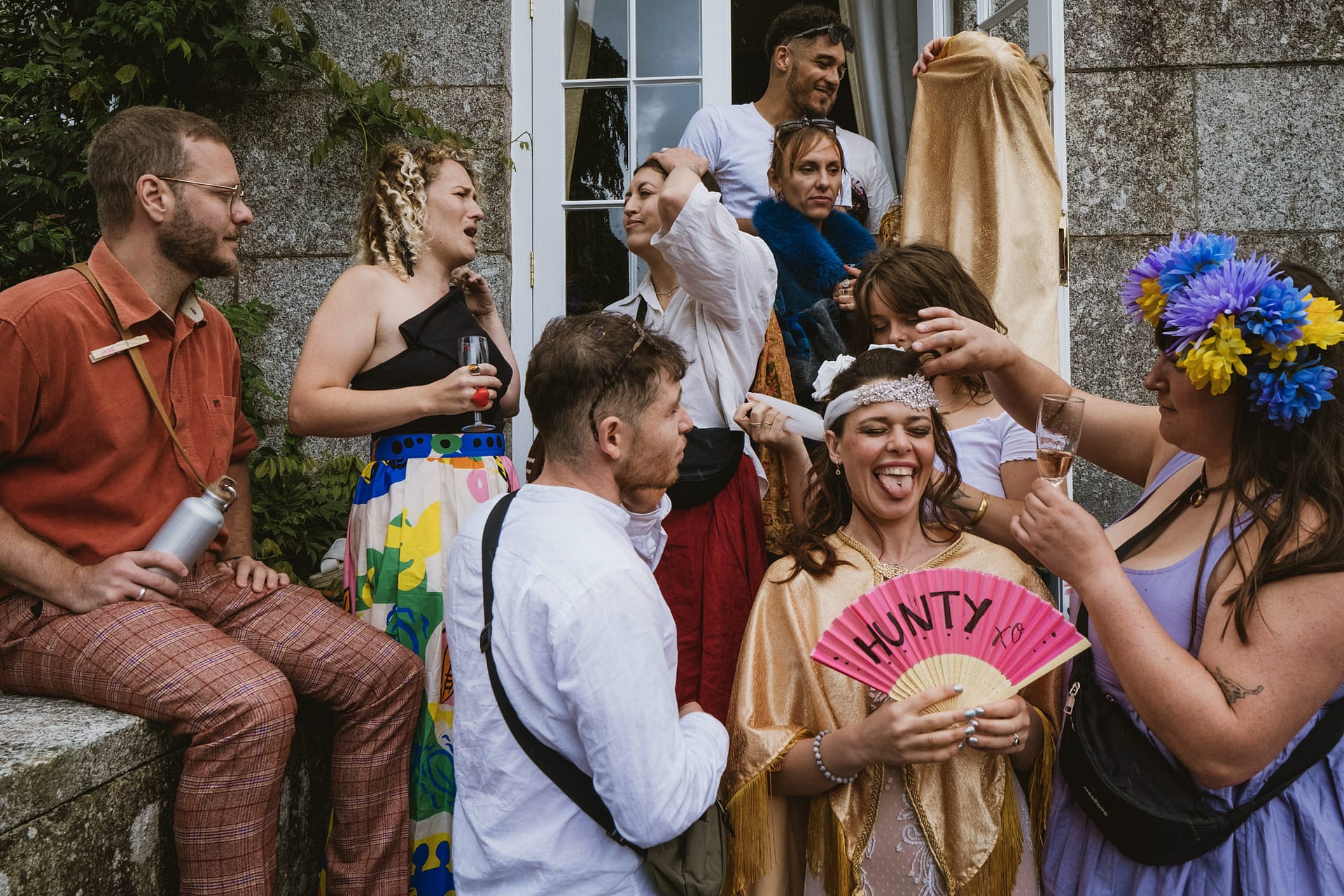 Group of people in colourful attire at a party.