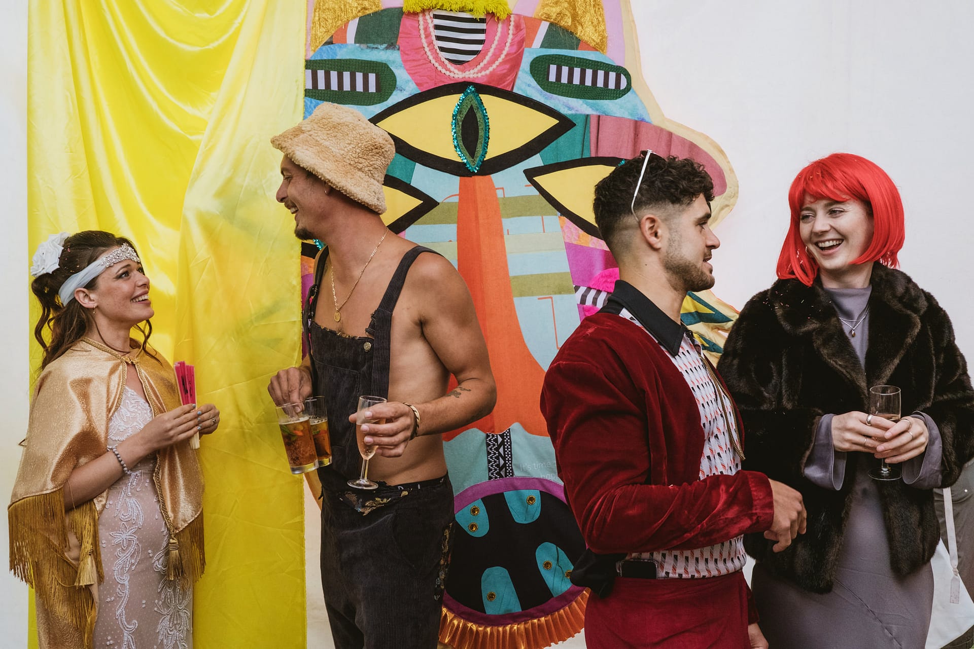 People in costumes enjoying a colourful party