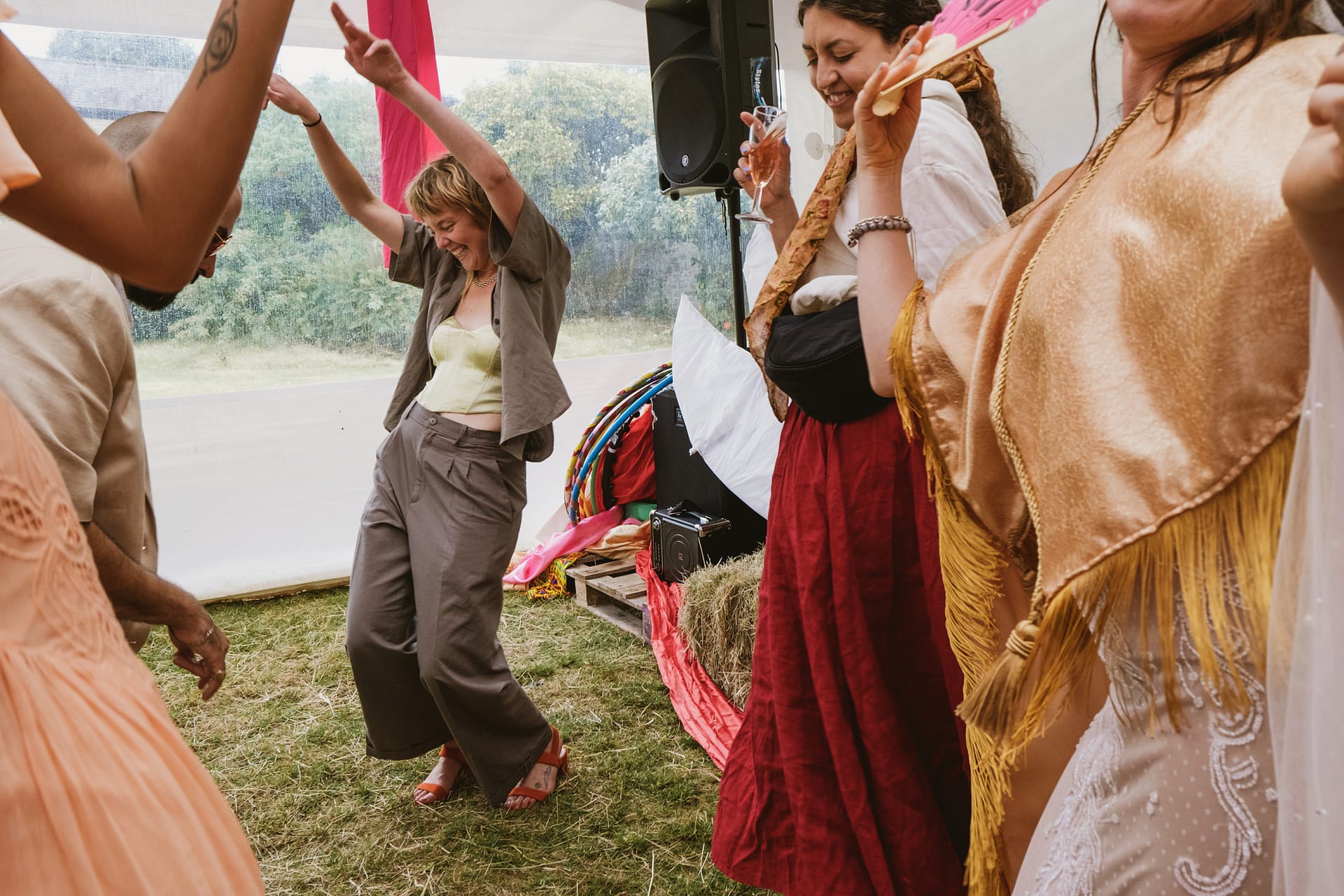 People dancing at an outdoor party.