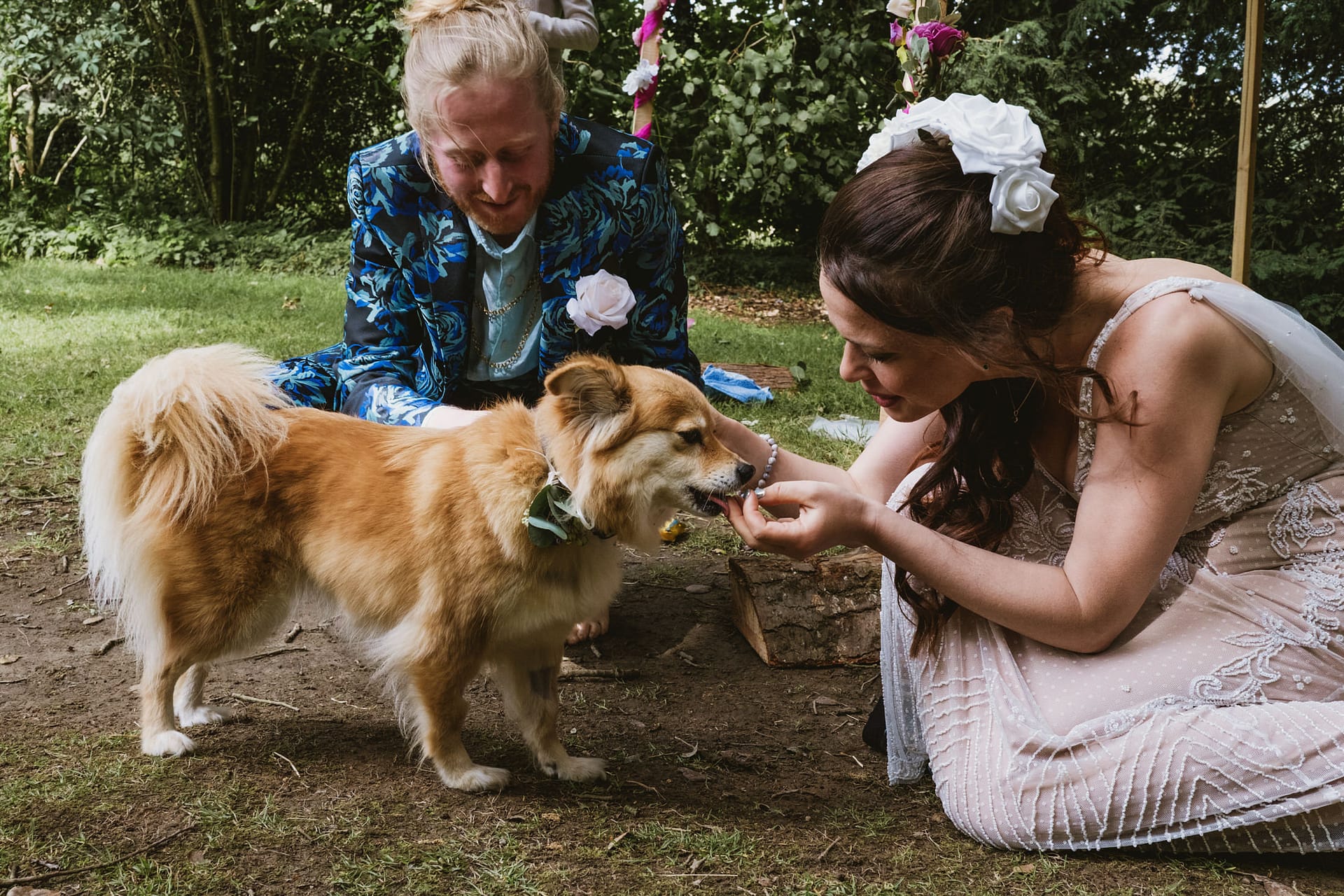 Bride and groom with dog at wedding