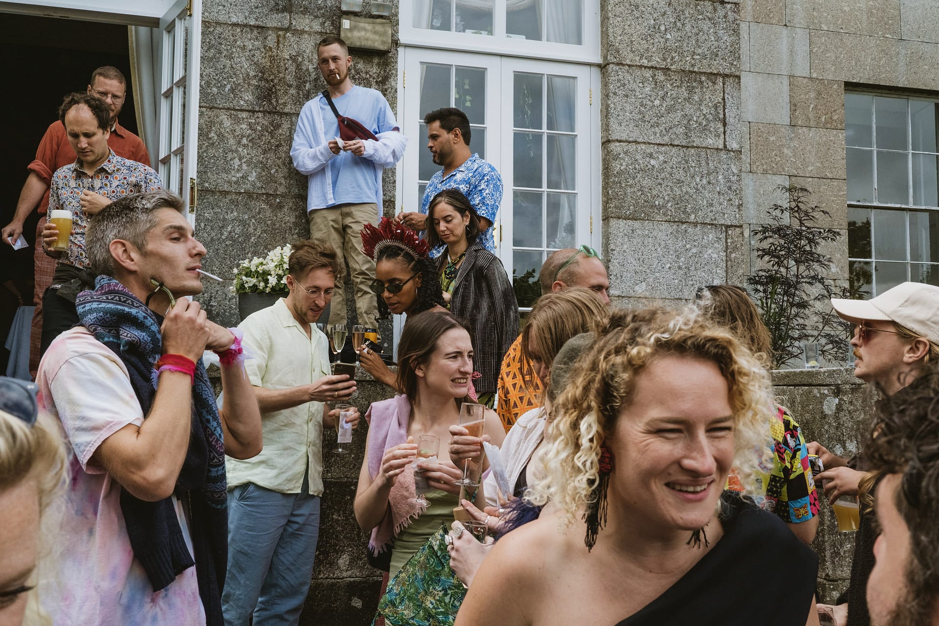 Group of people socializing at outdoor event.